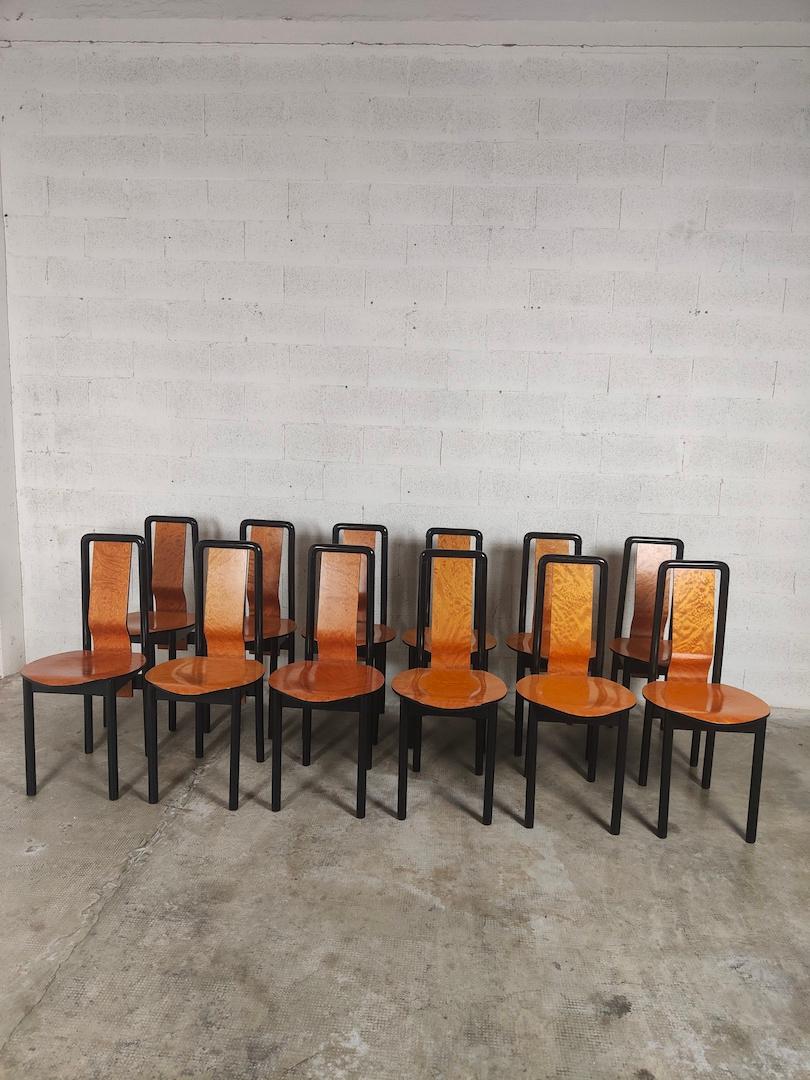 Set of 12 dining chairs by Pierre Cardin. The structure is in wood and the seat in briar. Pierre Cardin, born Pietro Costante Cardino (2 July 1922 – 29 December 2020) was an Italian-born naturalised-French fashion designer. He is known for what were