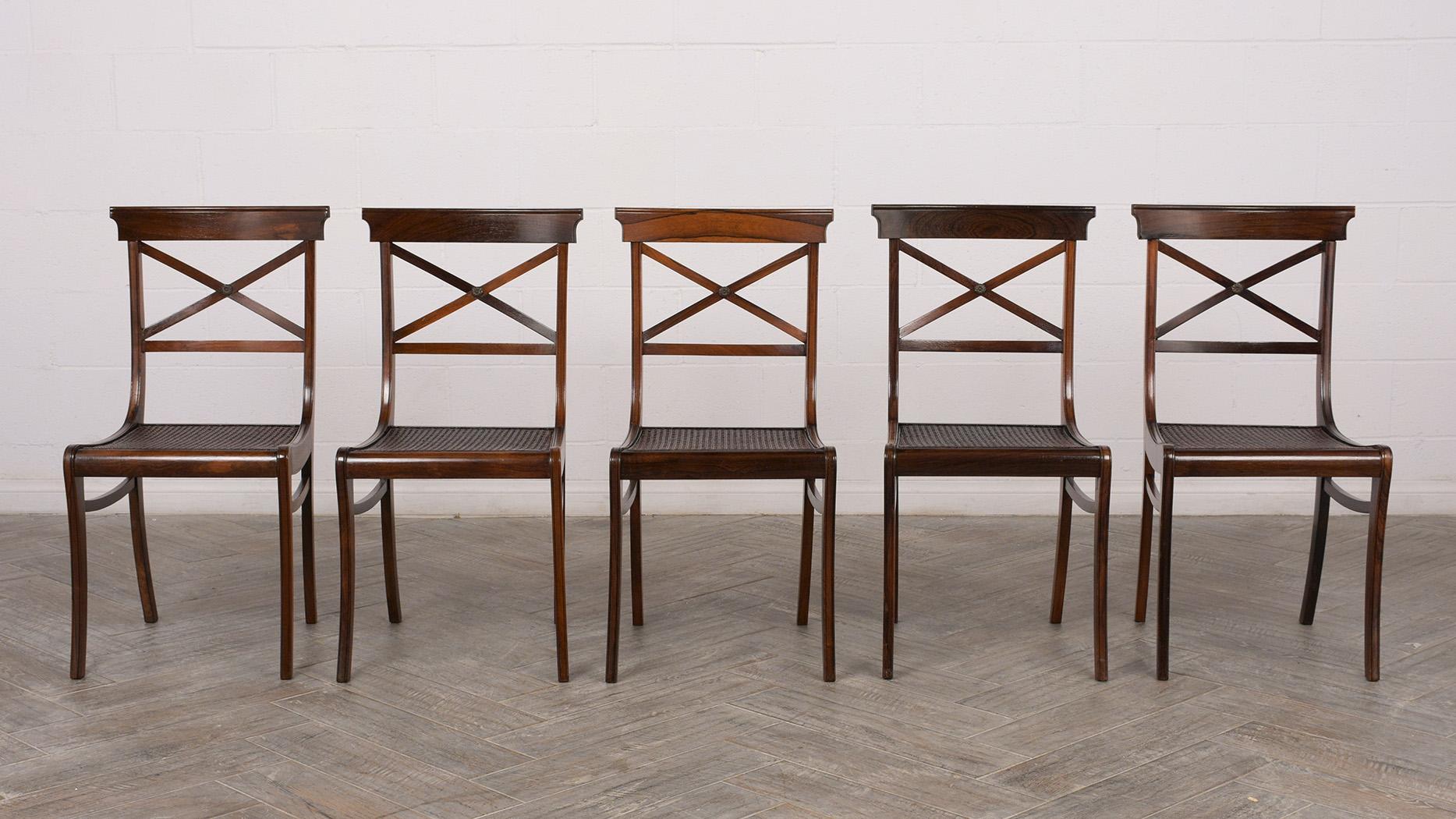 Set of 12 1890s dining chairs in Regency style, 2 armchairs and 10 side chairs. All chairs are made from solid rosewood and have the original rosewood finish. They have been professionally restored, all the caning has been replaced on all seats,