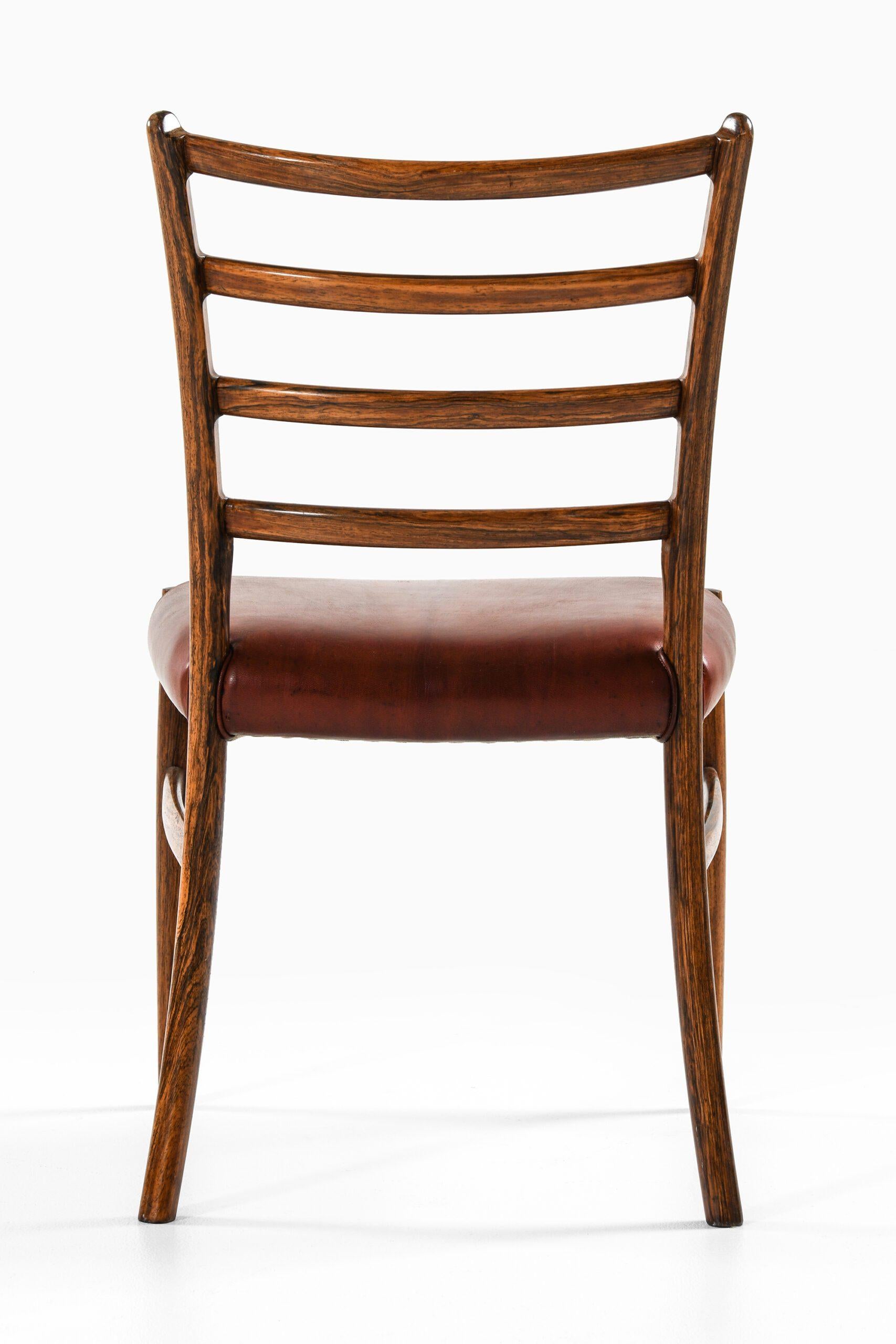 Set of 12 Dining Chairs in Rosewood and Leather, 1960s In Good Condition For Sale In Limhamn, Skåne län