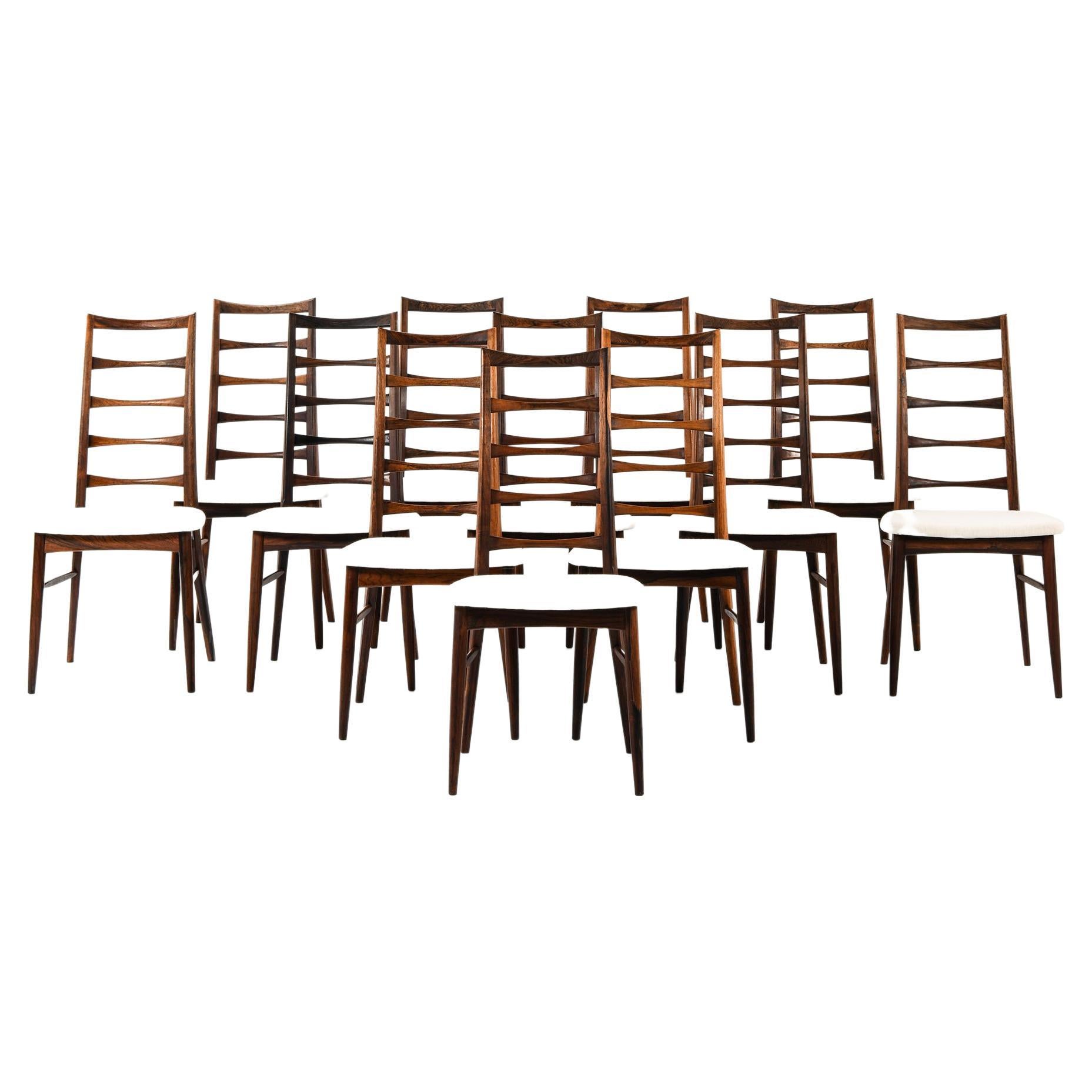 Ensemble de 12 chaises de salle à manger en bois de rose de Niels Kofoed, 1961 en vente