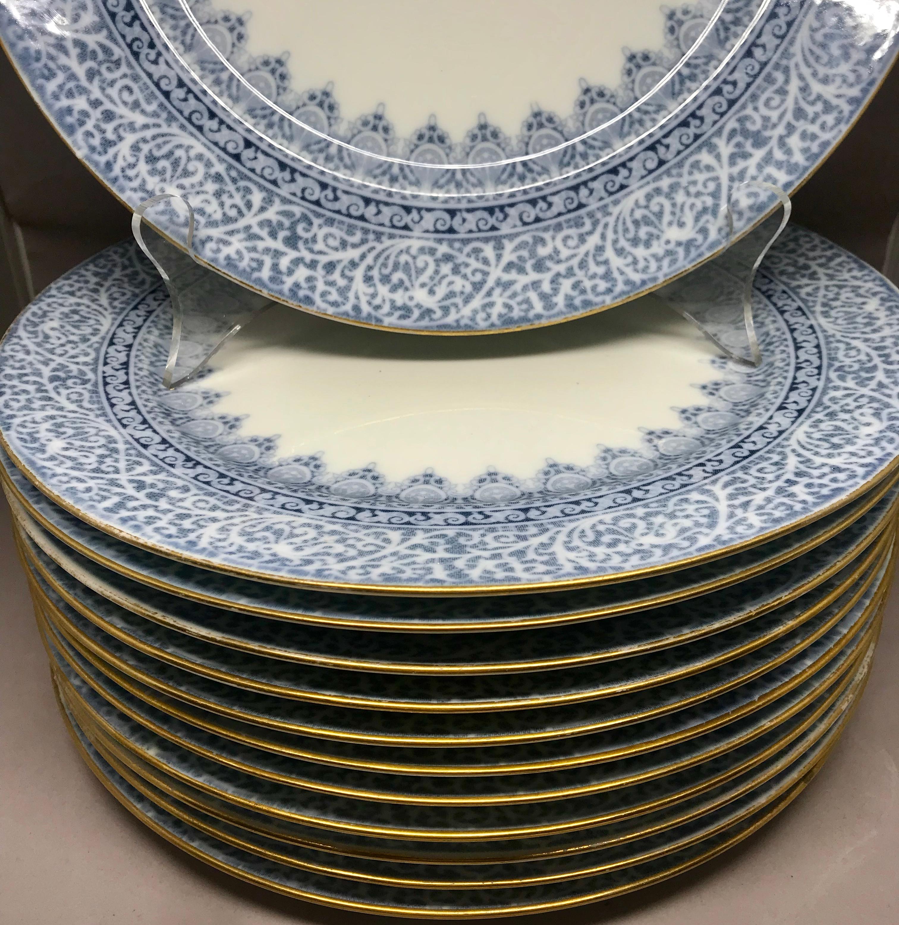 Set of 12 English blue and white dinner plates. 12 gilt-edge white dinner plates with pale and medium blue arabesque border. Retailed in America by C. A. Selzer of Cleveland. England, circa 1900.
Dimensions: 10.25