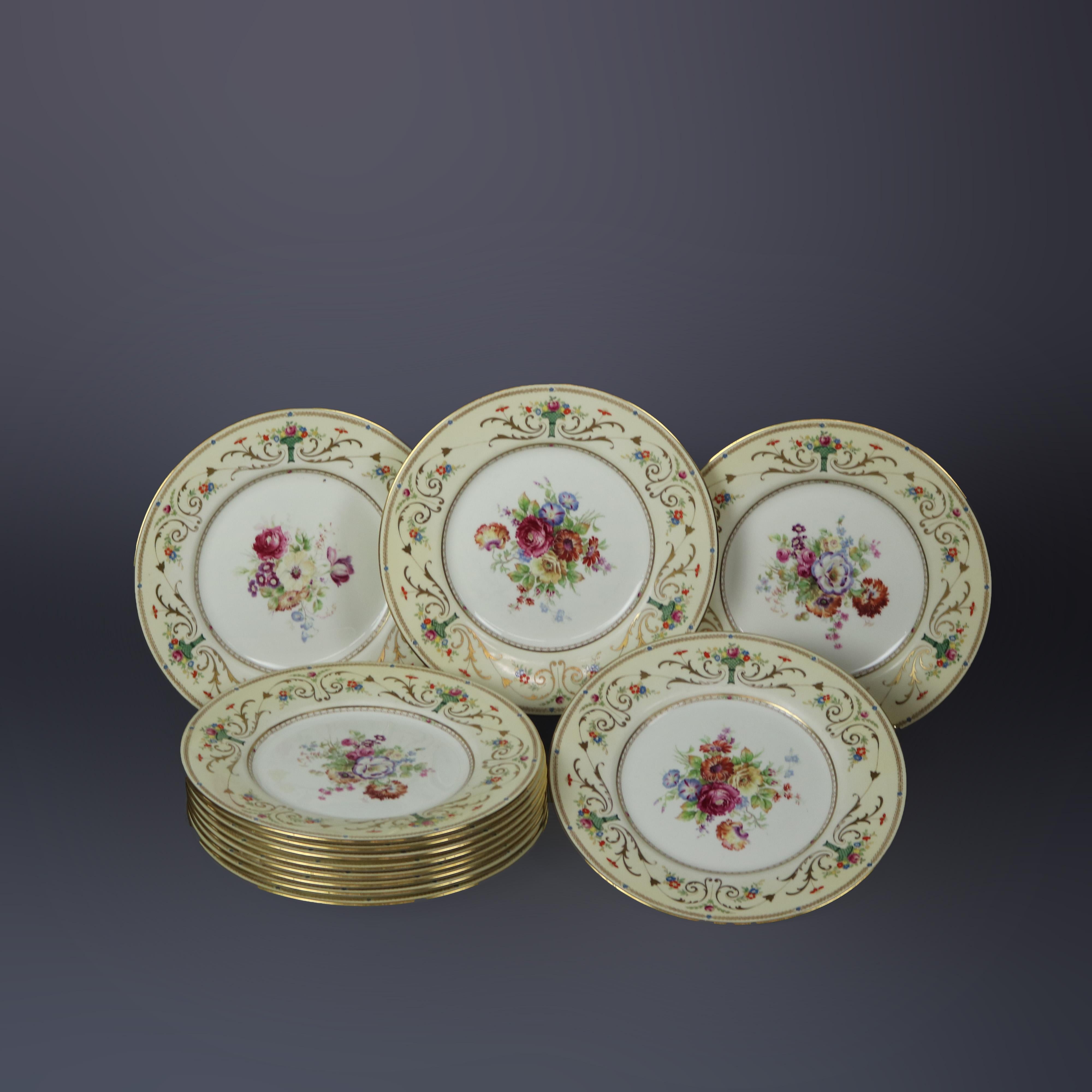 A set of twelve English dinner plates by Royal Doulton offer bone china construction with well having hand painted floral reserve with rim having repeating panier de fleurs and gilt scroll and foliate elements, en verso green maker mark stamp as