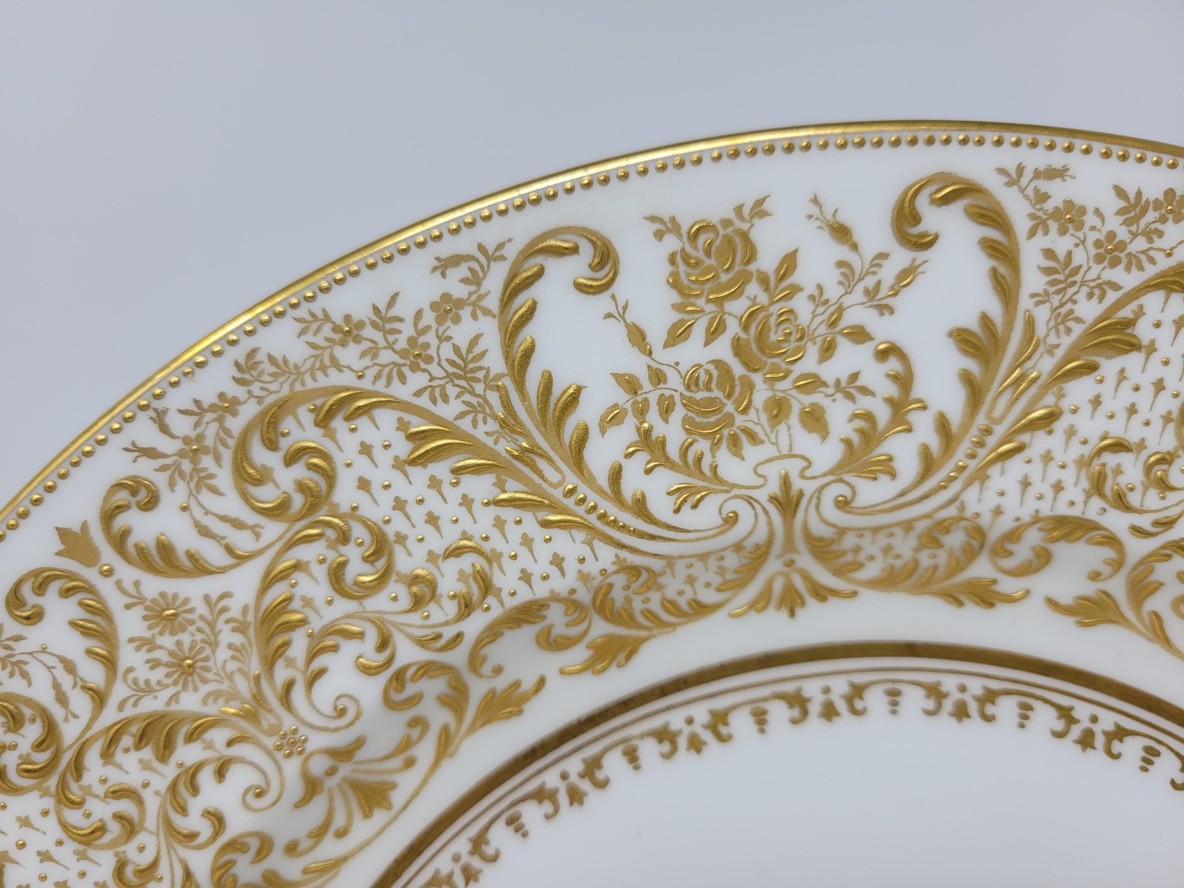 These lovely service plates were manfactured in England and retailed at Gilman Collamore & Co, NYC.