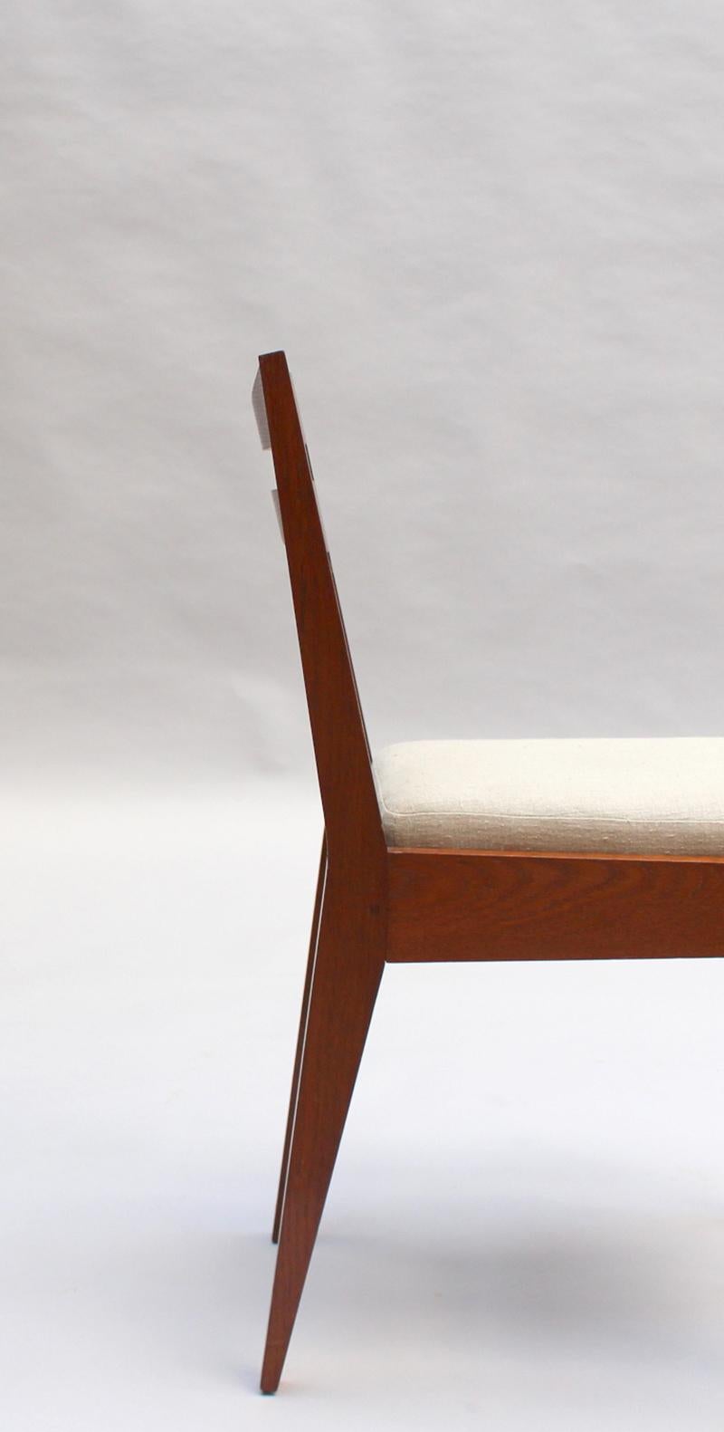 Satz von 12 feinen französischen Art-Déco-Esszimmerstühlen aus Eichenholz von Dudouyt im Angebot 4