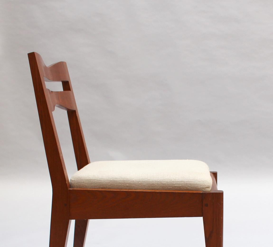 Satz von 12 feinen französischen Art-Déco-Esszimmerstühlen aus Eichenholz von Dudouyt im Angebot 5