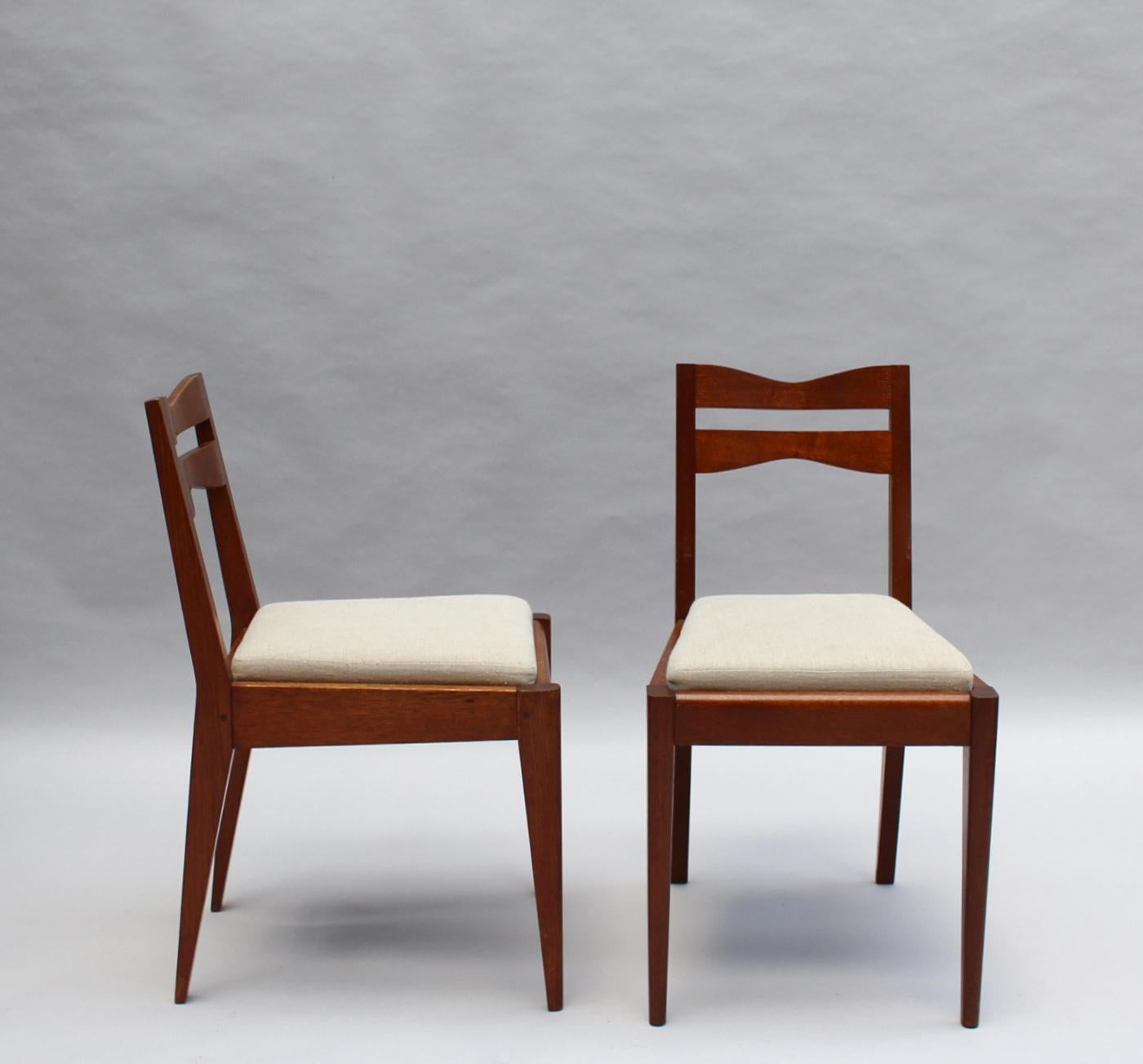 Satz von 12 feinen französischen Art-Déco-Esszimmerstühlen aus Eichenholz von Dudouyt im Angebot 12