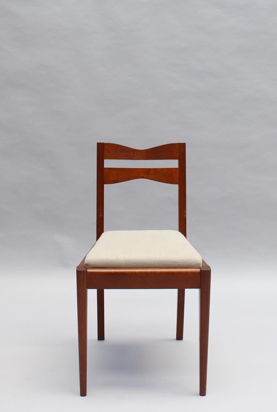Satz von 12 feinen französischen Art-Déco-Esszimmerstühlen aus Eichenholz von Dudouyt (Art déco) im Angebot