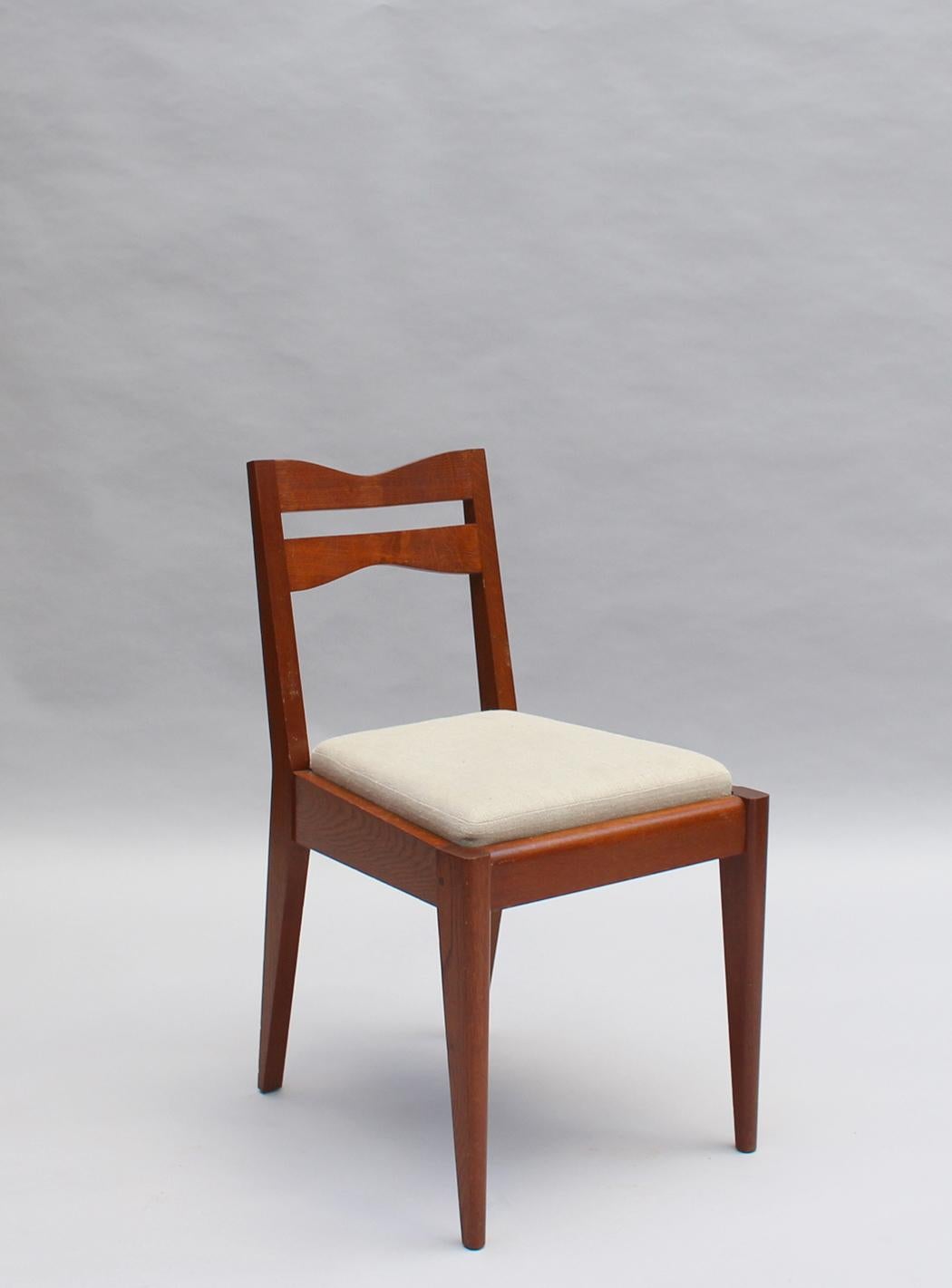 Satz von 12 feinen französischen Art-Déco-Esszimmerstühlen aus Eichenholz von Dudouyt (Französisch) im Angebot