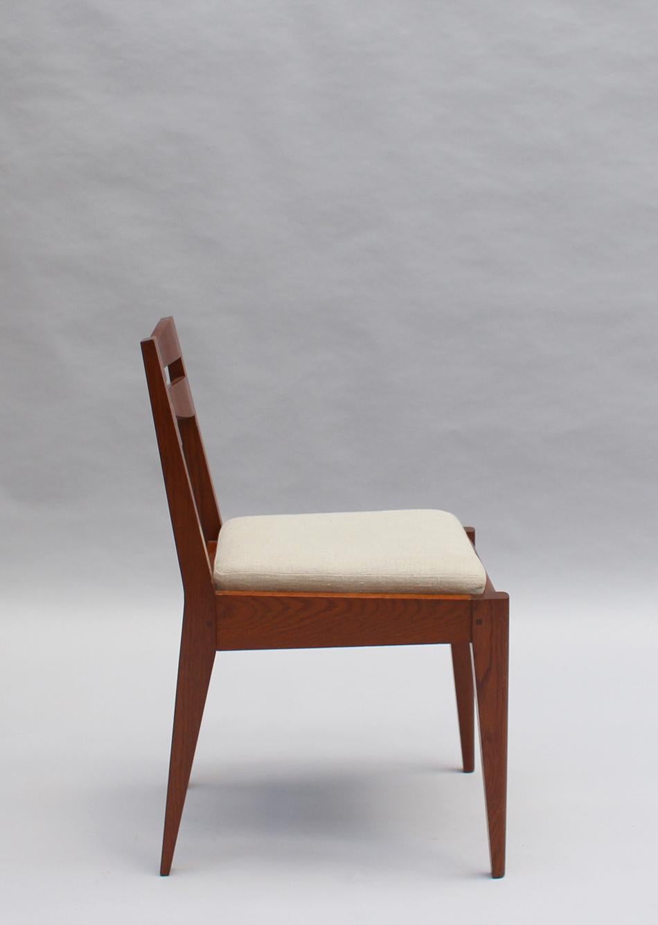Satz von 12 feinen französischen Art-Déco-Esszimmerstühlen aus Eichenholz von Dudouyt im Zustand „Gut“ im Angebot in Long Island City, NY