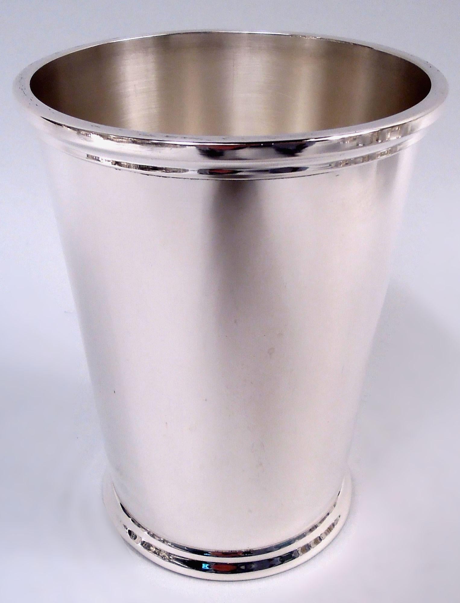 Set of 12 tall sterling silver mint juleps. Made by Fisher Silversmiths, Inc. in Jersey City. Each: Straight and tapering bowl; mouth rim stepped and flat and foot spread. Fully marked including maker’s stamp and no. 85. Total weight: 65 troy ounces.