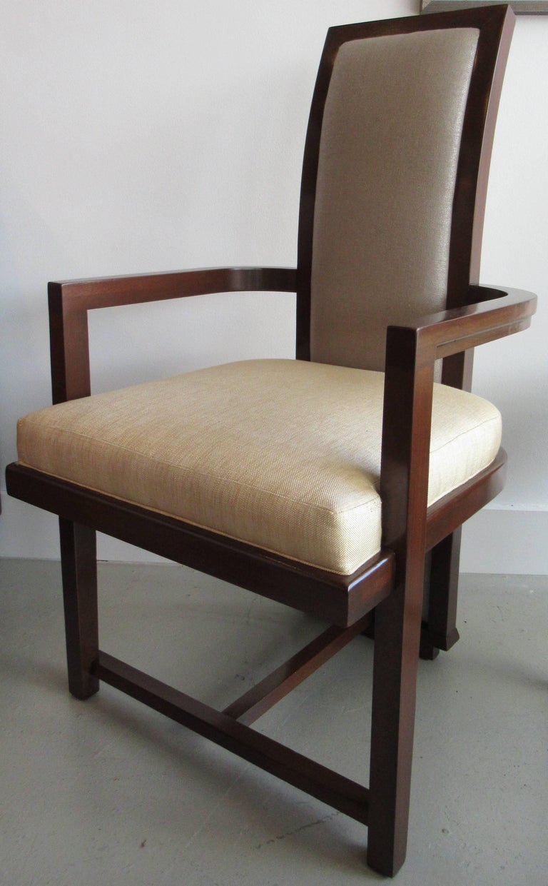 Set of 12 dining chairs comprising two arms and ten sides.