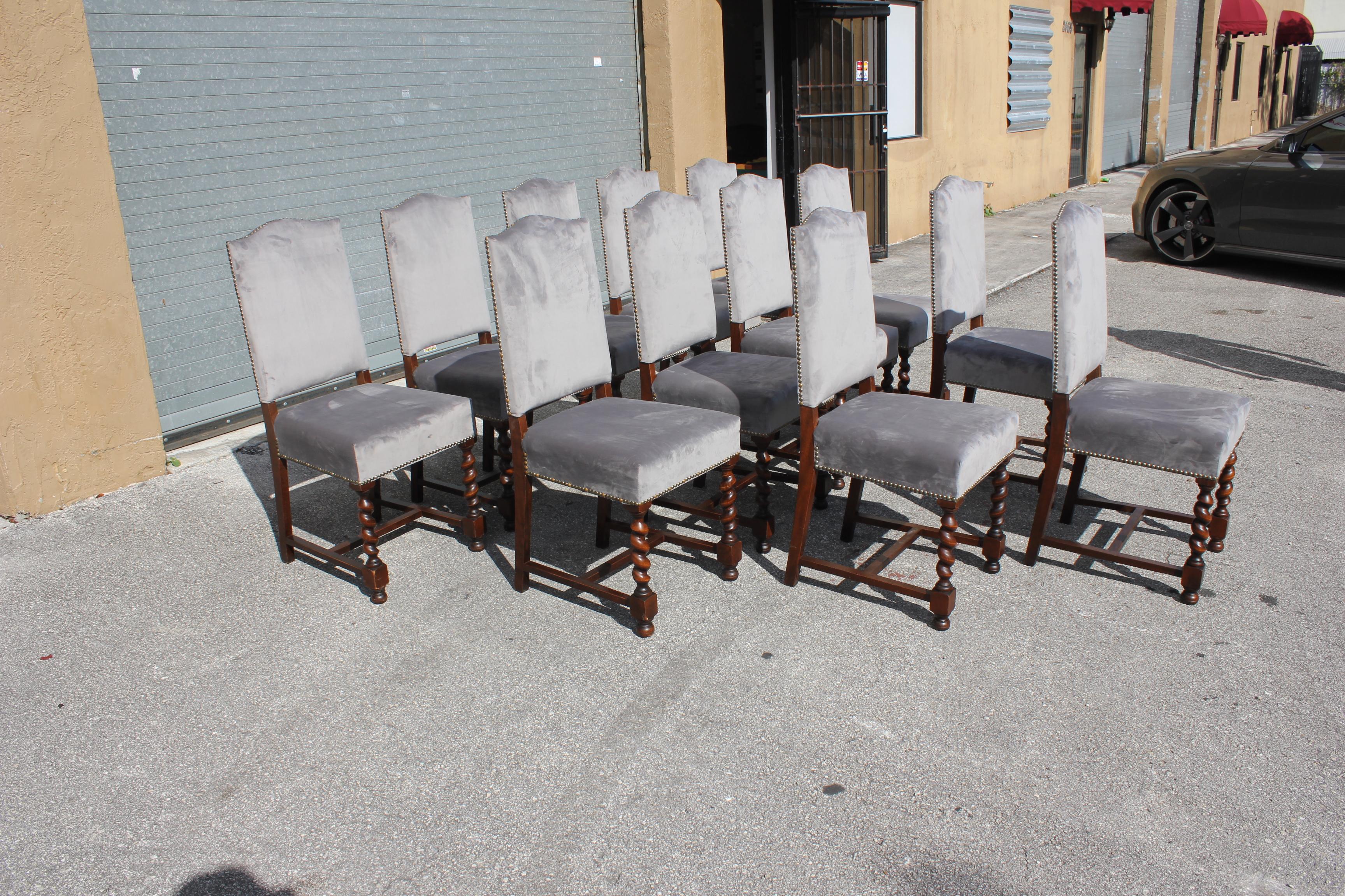 Fine set of 12 Louis XIII style barley twist dining chairs with chapeau de gendarme backs, circa 1900s? With a deep rich patina, these comfortable chairs are solid and very sturdy, ready for everyday use. Newly upholstered with a beautiful gray