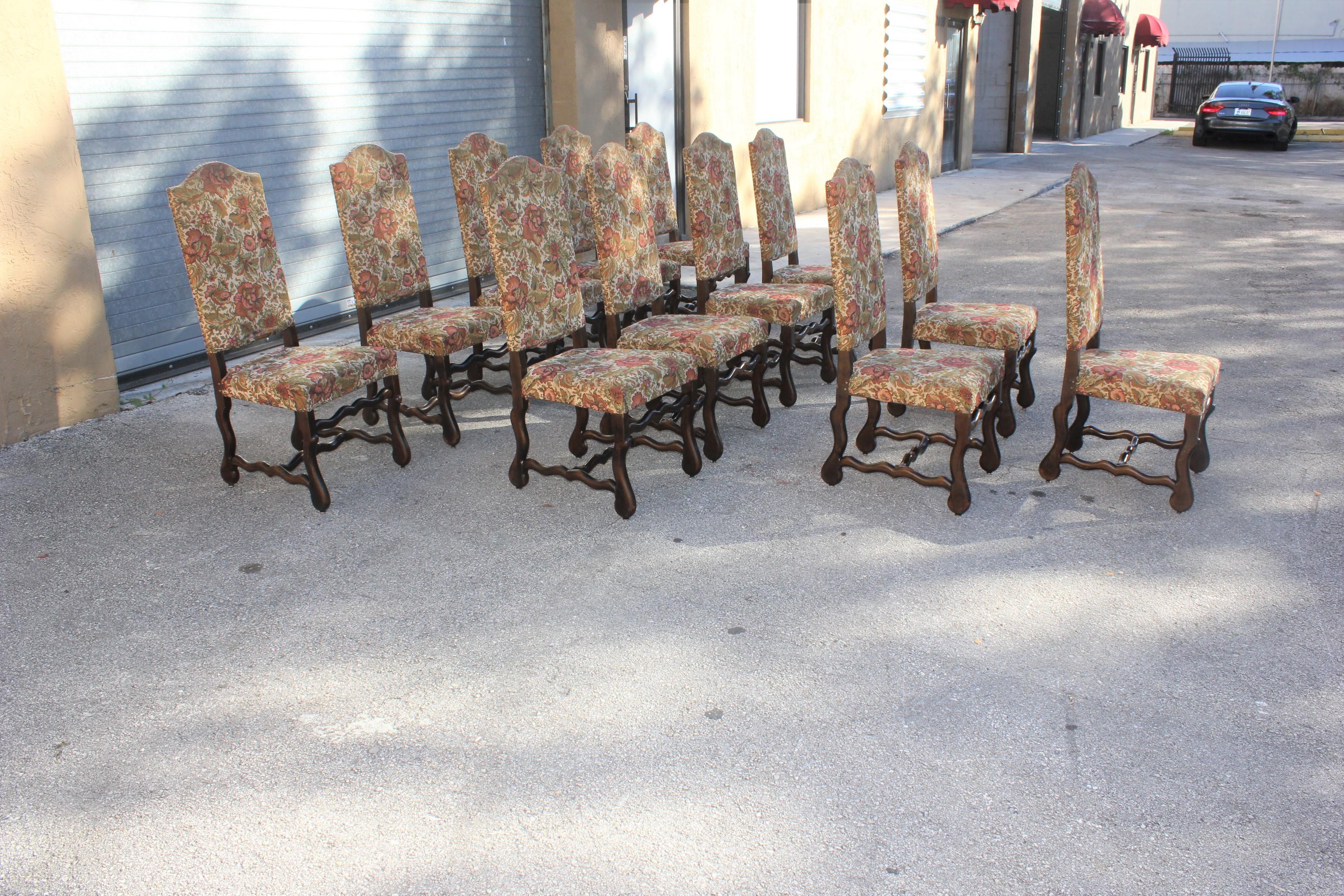 Fine set of 12 Louis XIII style Os de Mouton dining chairs with chapeau de gendarme backs, circa 1900th century. Vintage fabric upholstery with nail heads, solid walnut chair frames are in excellent condition. From South France . ( fabric