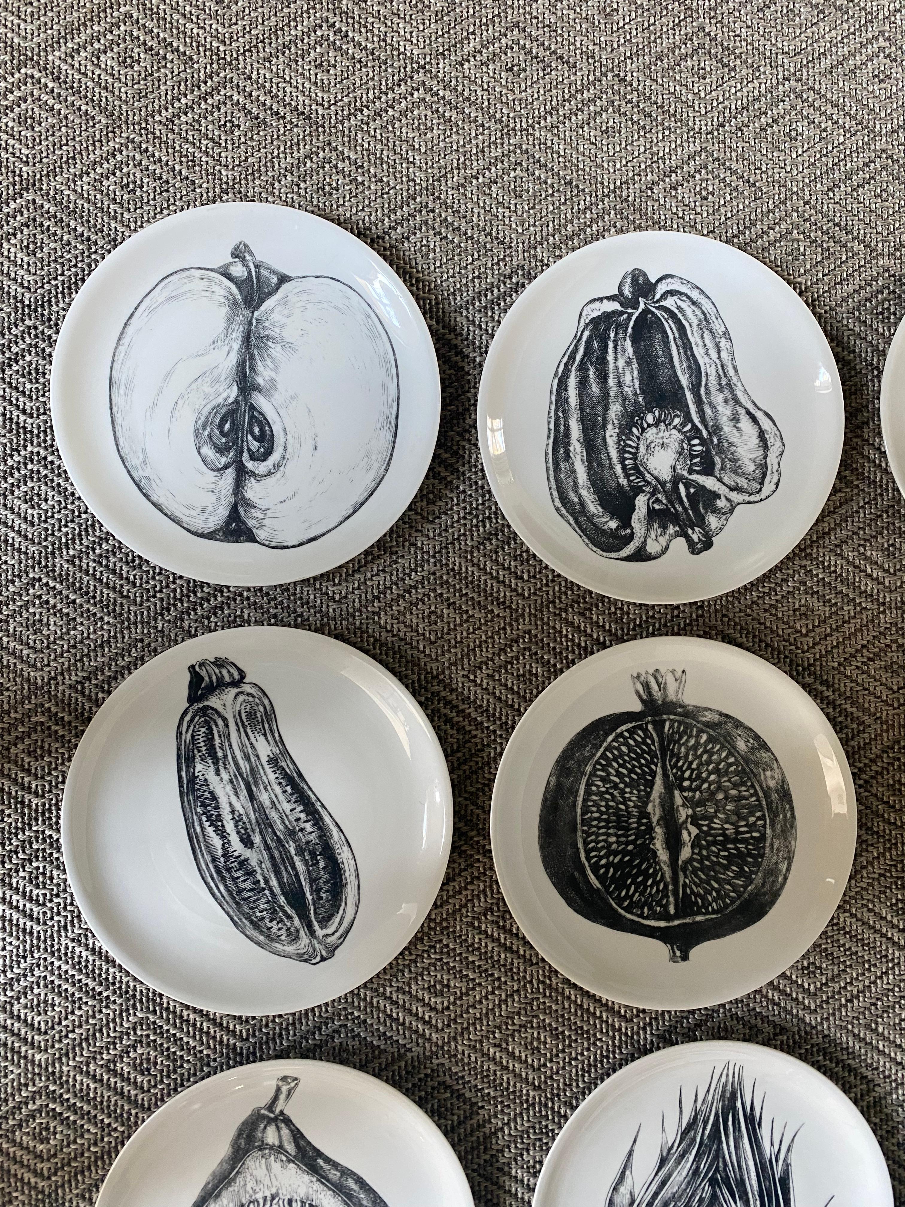 Set of 12 black and white transfer printed fruit and vegetable motif plates.
Designed by Fornasetti in Italy.