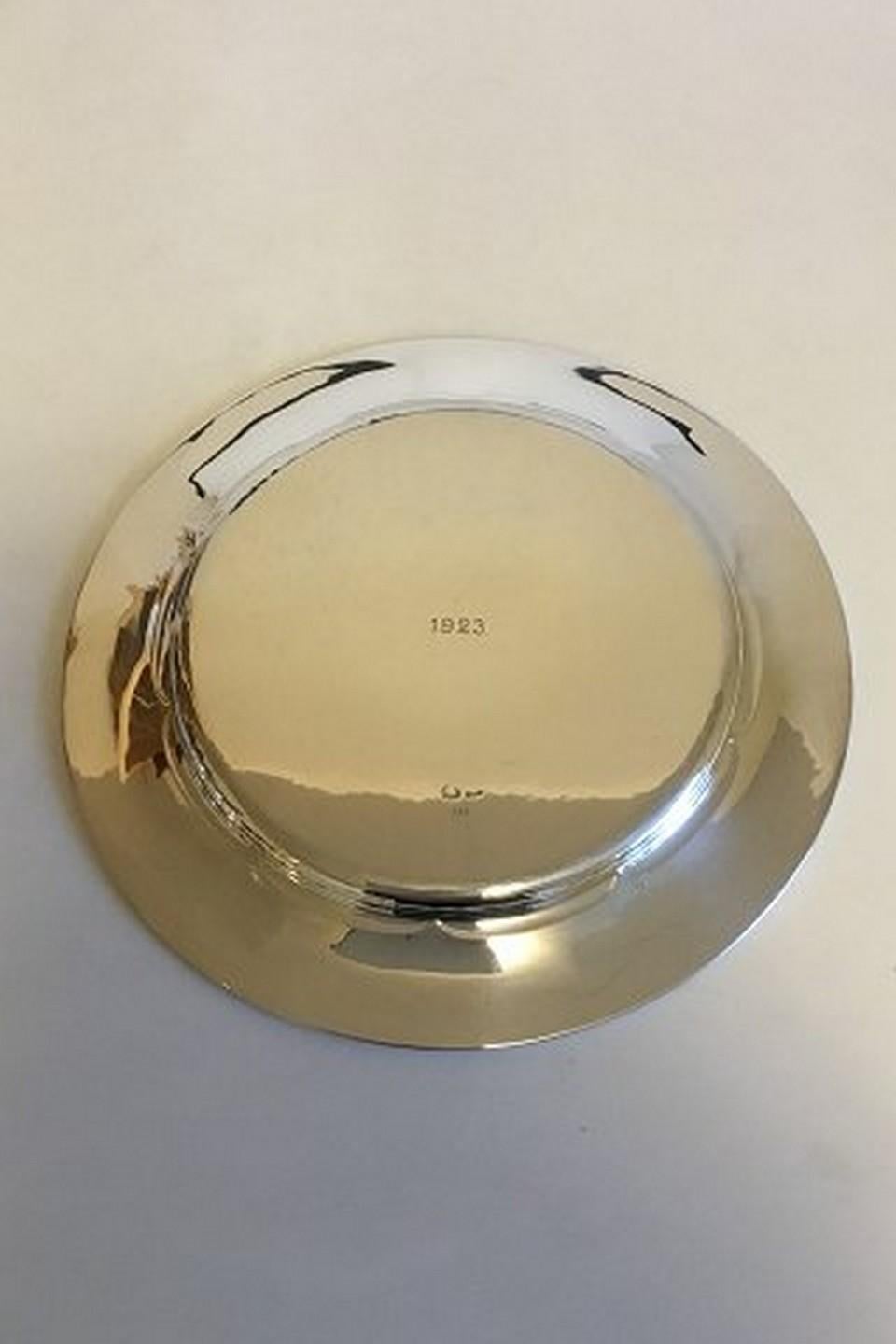 Set of 12 Georg Jensen sterling silver charger/plate no 232. 
Measures 24 cm / 9 29/64 in. diameter. Weighs 5150 g / 180.6 oz.
Item no.: 351802.