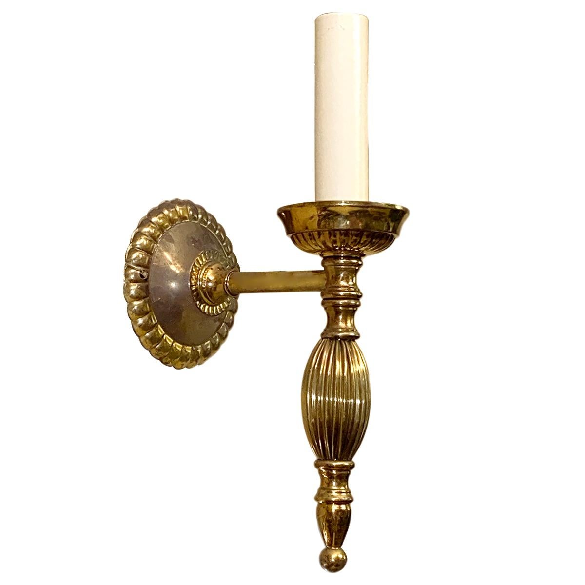 Set of 12, circa 1940's Italian gilt bronze Neoclassic style sconces with gilt finish. Sold per pair.

Measurements:
Height: 9.5