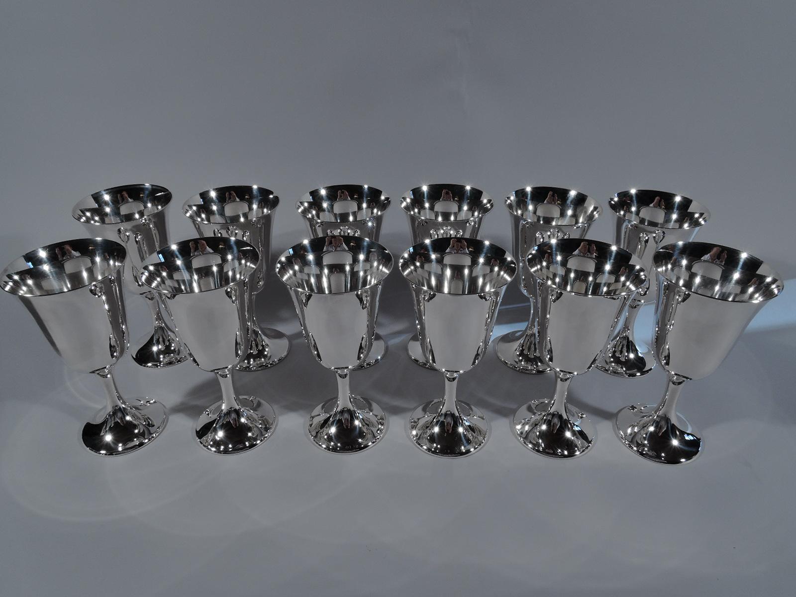 Set of 12 Puritan sterling silver goblets. Made by Gorham in Providence. Each: Spare and elegant form with subtle bell-form bowl on cylindrical stem flowing into raised foot. Works best when filled and refilled. Don’t be fooled by the pattern name.