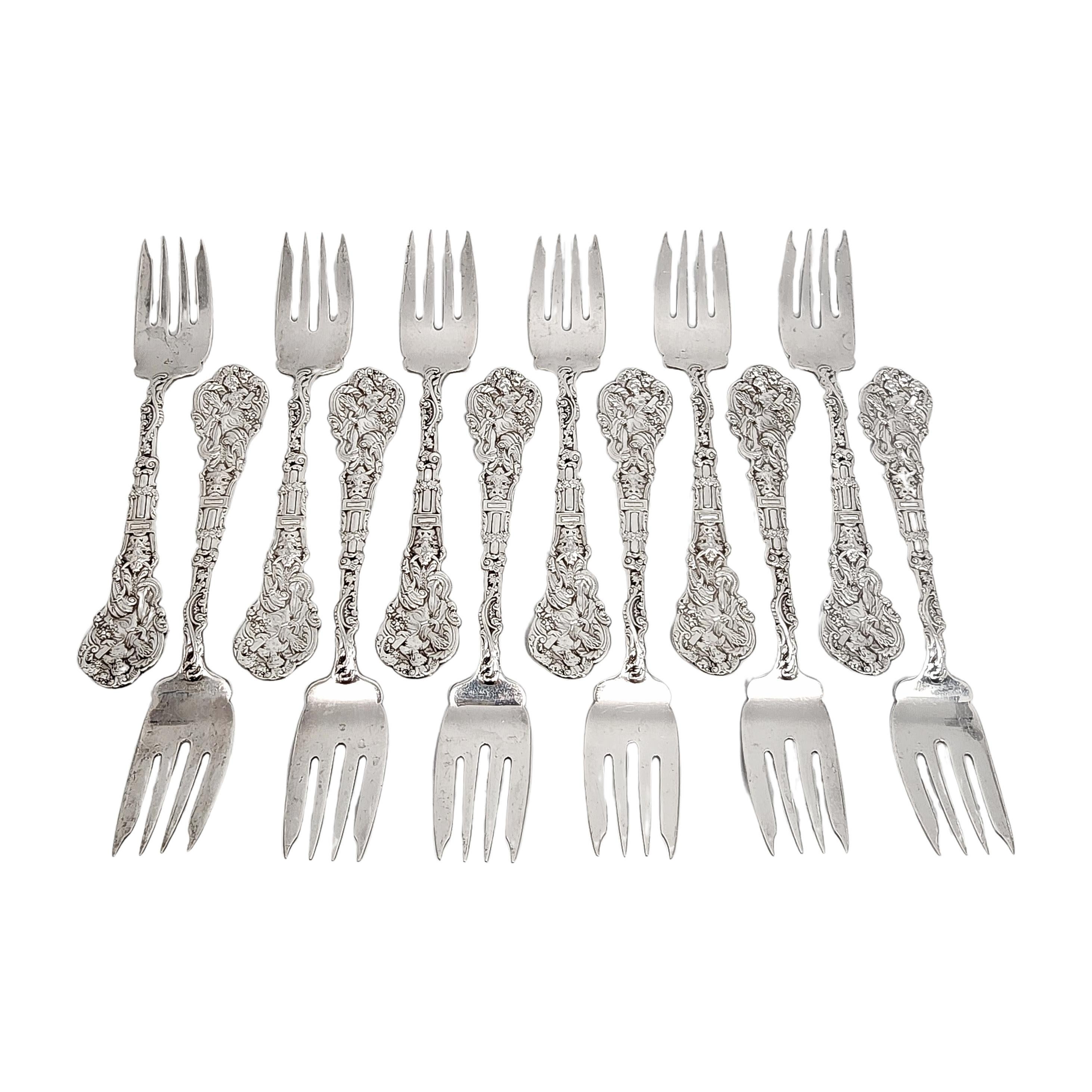 Set of 12 sterling silver salad forks by Gorham in the Versailles pattern.

No monogram

Gorham's Versailles is a multi motif pattern designed by Antone Heller in 1885. Named for the Palace of Versailles, the pattern depicts ornate scenes of