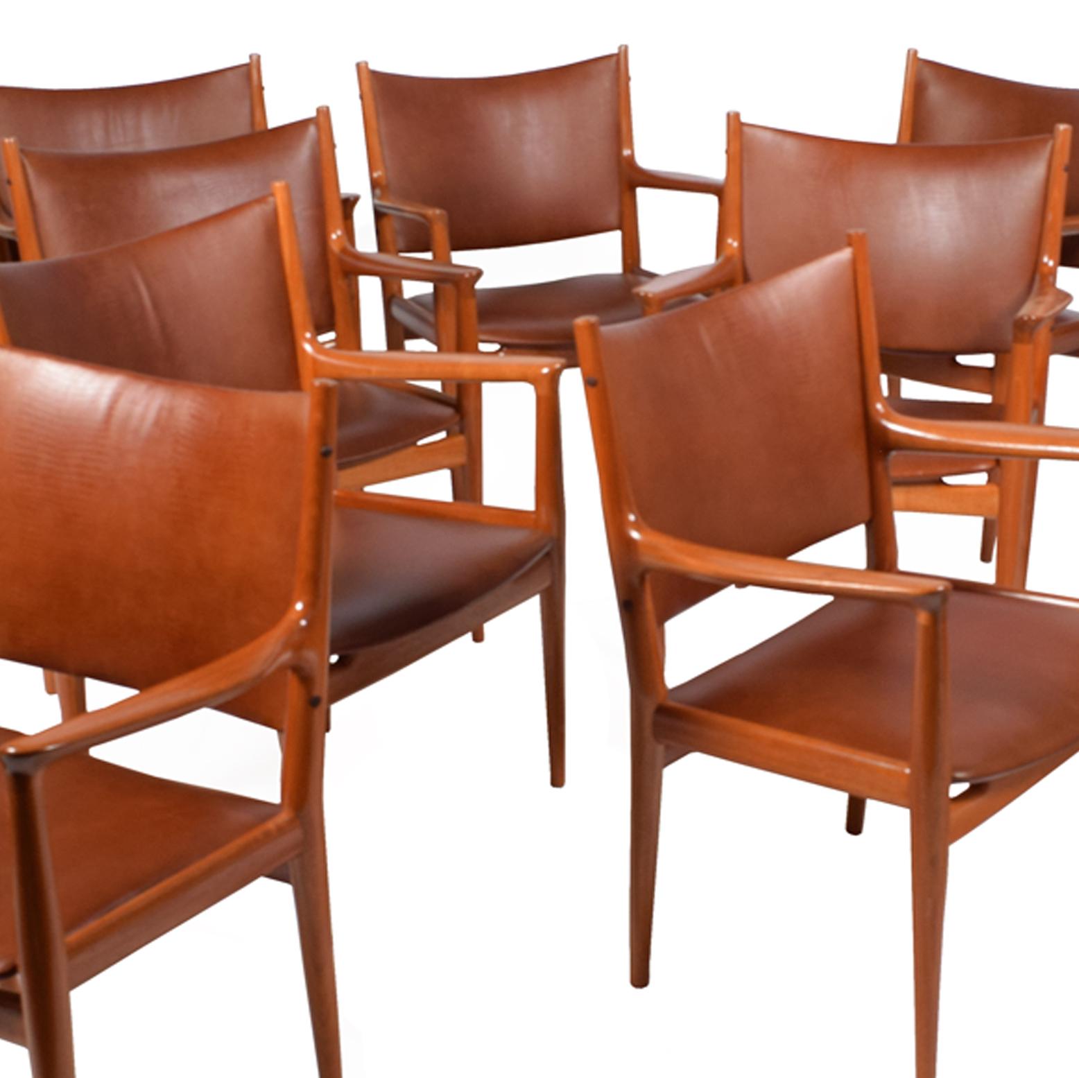 Solid mahogany armchairs design by Hans Wegner for Johannes Hansen cabinet maker model 513 restored and new leather upholstery each with JH metal tag.
Measure: Arm height 27