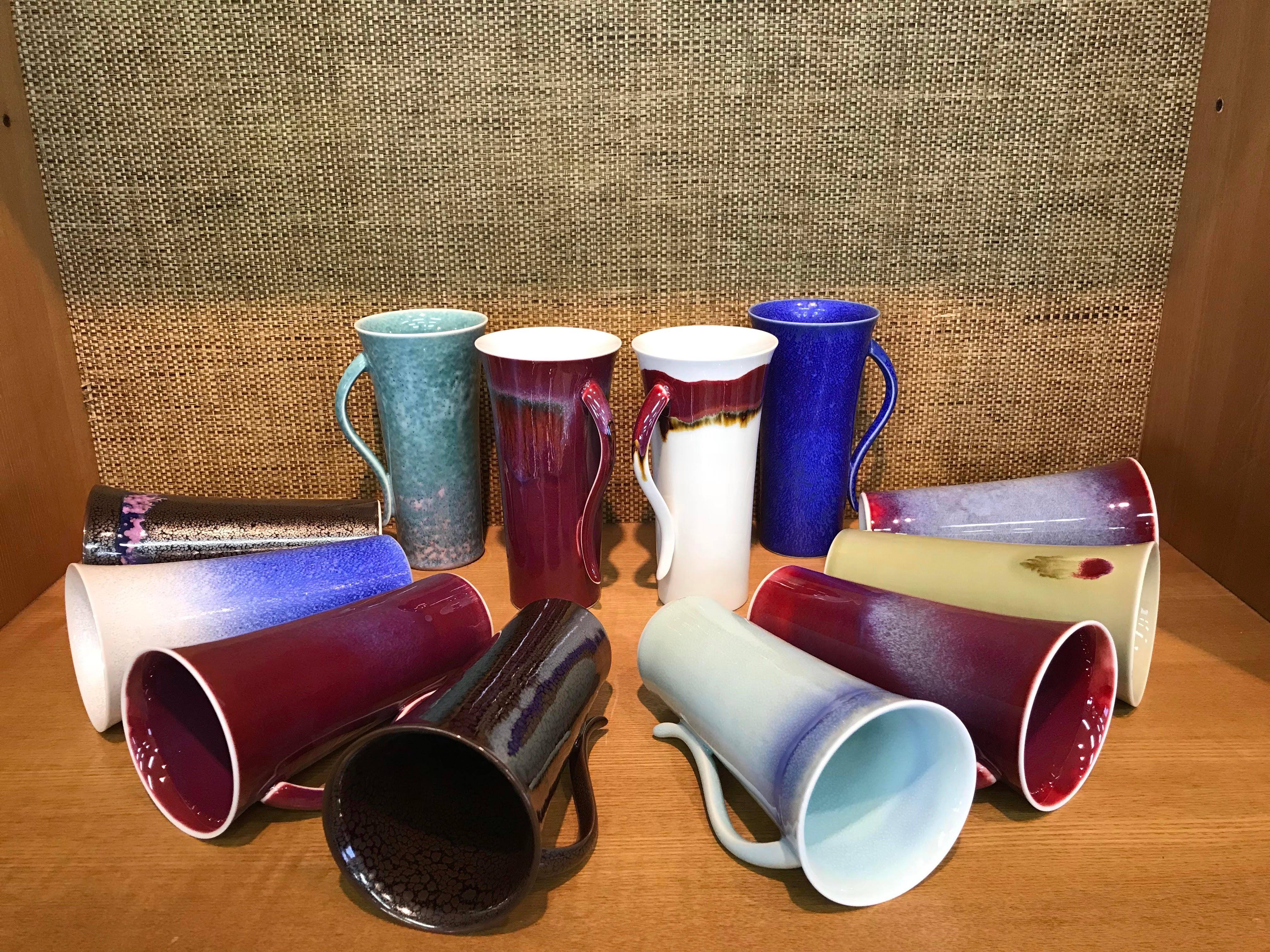 Unique extraordinary set of 12 Japanese contemporary tall hand-glazed porcelain mugs/cups in a beautiful shape masterfully glazed in the artist's breathtaking signature colors like wine-red, green and white, signed pieces by widely respected