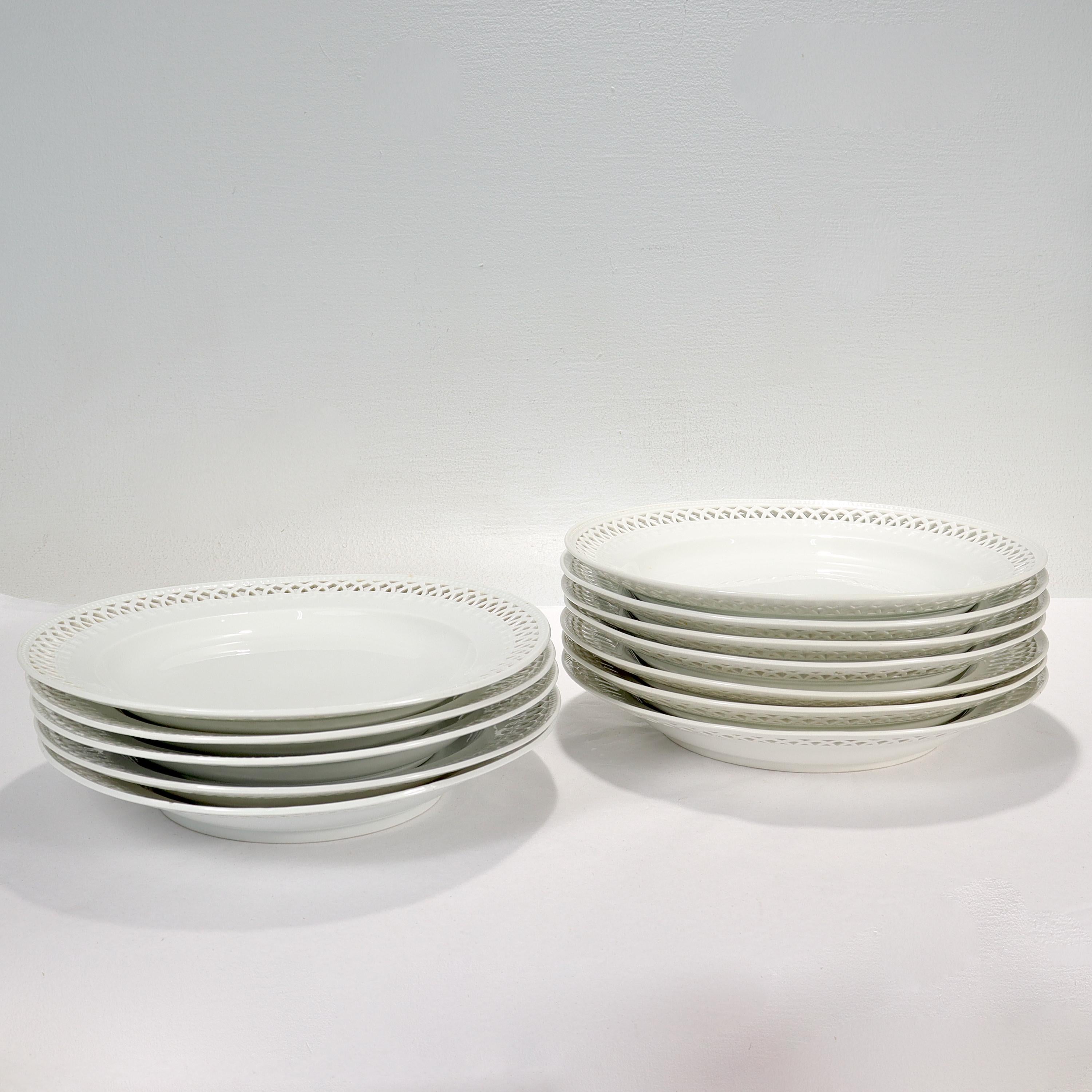 A fine assembled set of 12 reticulated blanc de chine porcelain plates.

By KPM Royal Berlin.

The plates are undecorated (or blanc de chine) with reticulated Jugendstil style rim. 

The plates vary slightly in size and a few are slightly out