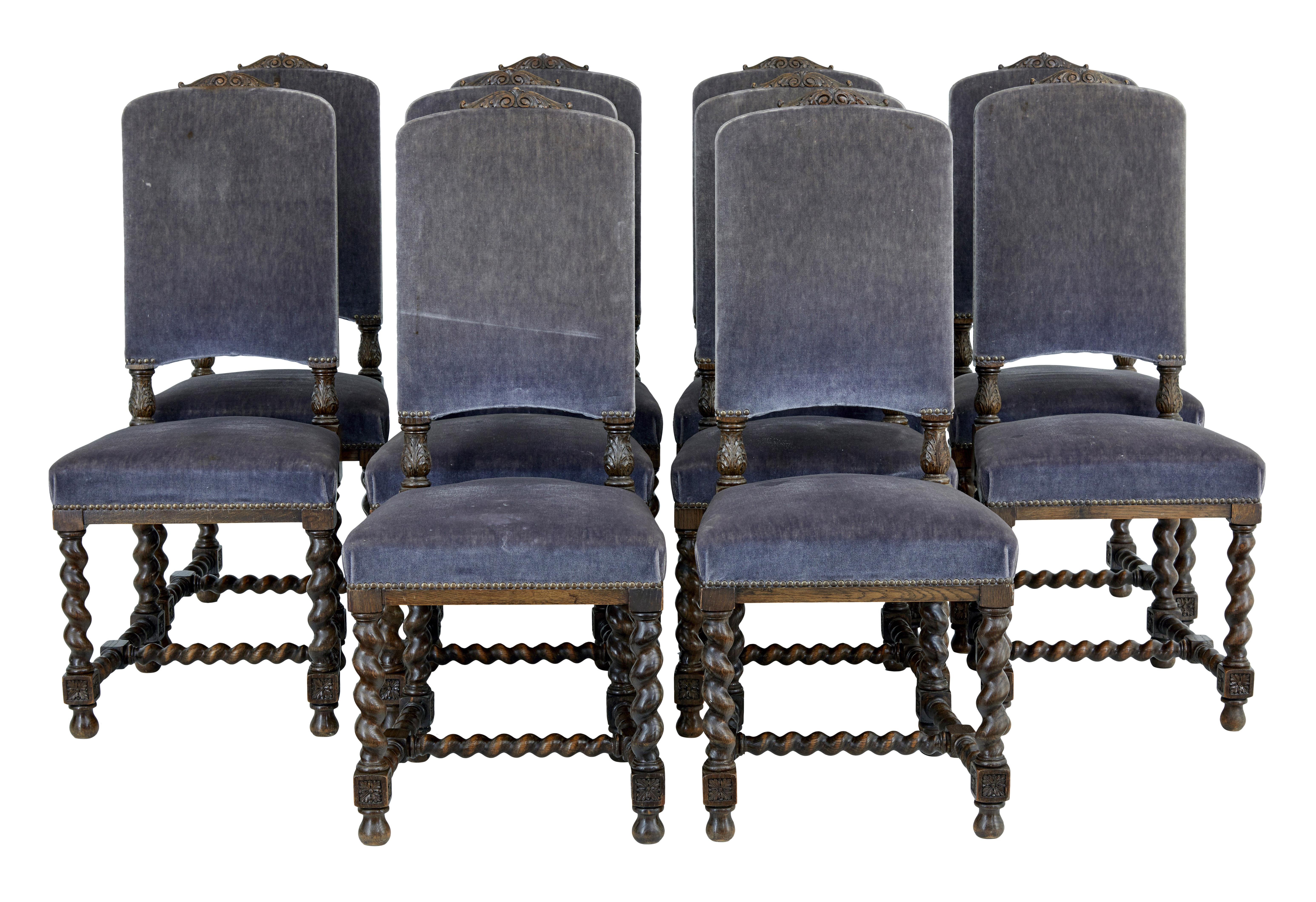 Good quality large set of 12 dining chairs, circa 1890.

Set comprising of 10 single and a pair of carver armchairs. Armchairs with tall backs, carved scrolling arms with acanthus detail on the end. Back rests all supported by the same carved