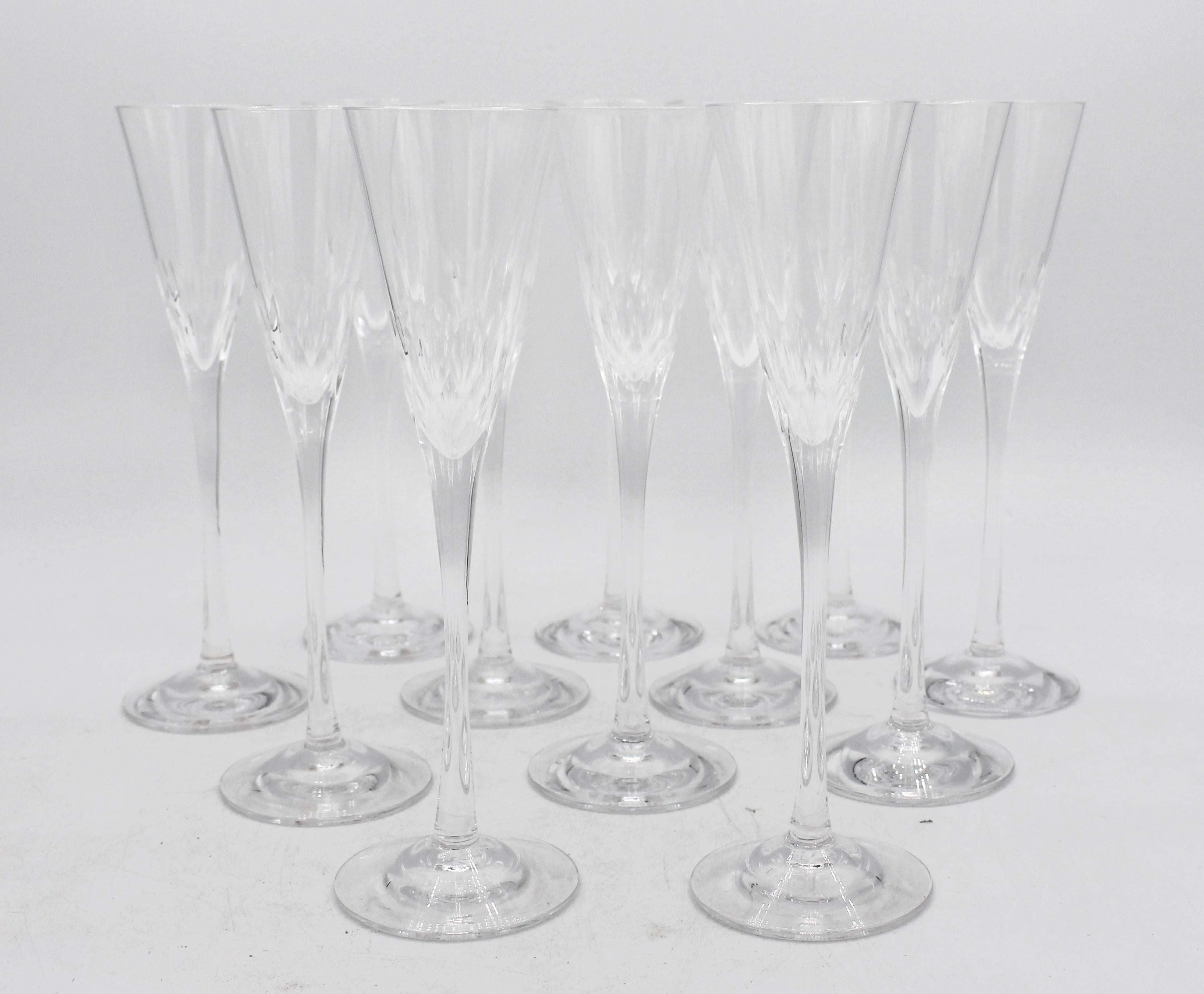 Late 20th century set of 12 Orrefors Prelude schnapps stemmed glasses. A 1957 design by Nils Landberg for Orrefors. With a mid century modern cut bowl band. Mouth blown & hand cut.
6 7/8