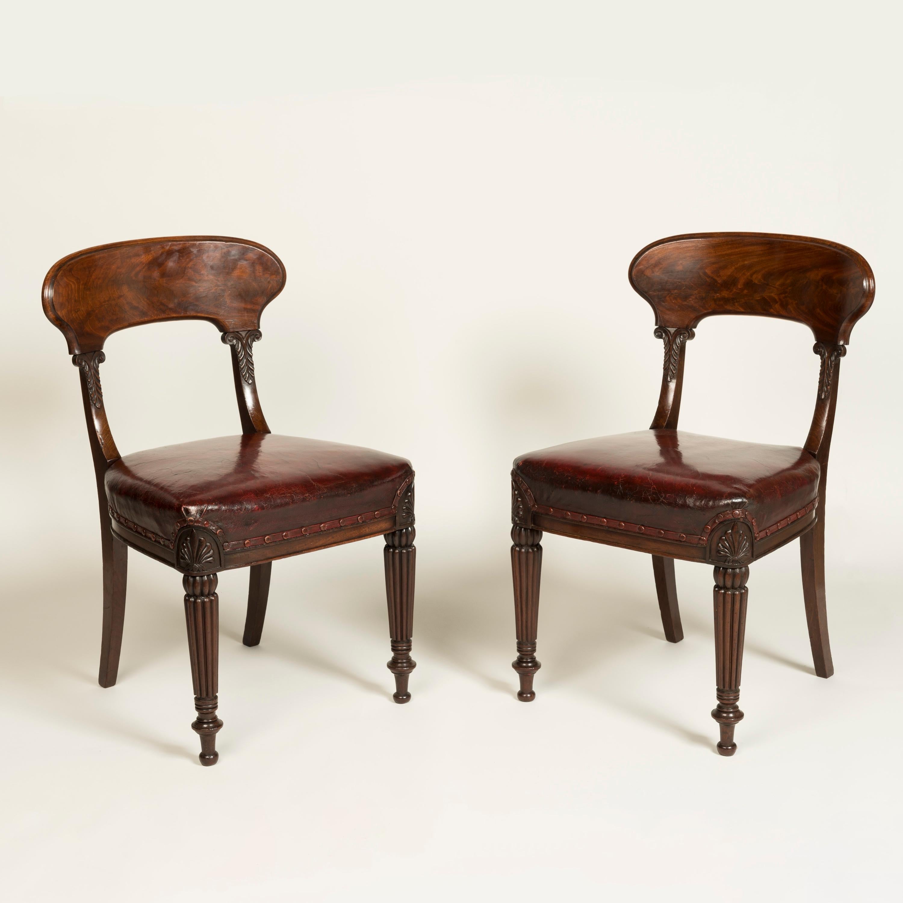 A Fine set of Twelve George IV Dining Chairs
Attributed to Gillows of London & Lancaster

Constructed from flamed Cuban mahogany, with hand-carved details; supported on tapering, turned and reeded front legs headed by anthermion-carved corners