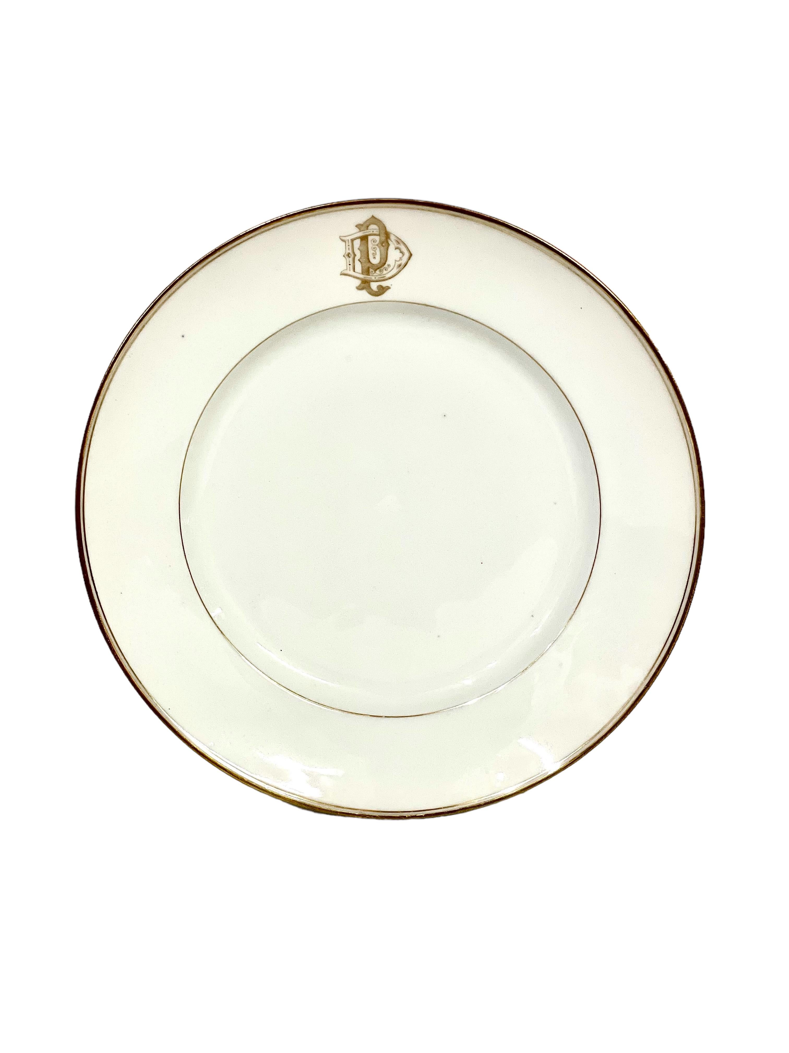 A set of 12 stylish dessert plates in delicate white Limoges porcelain, each piece edged with a fine rim of gilt, and bearing the elaborately formed monogramme 'DP'. Dating from the late 19th century, the set is in excellent overall condition, with