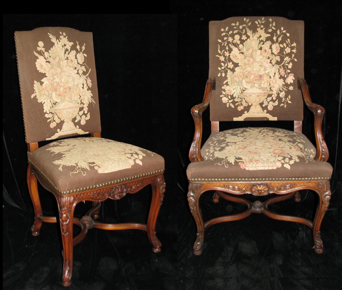 Magnificent set of 12, 19th or 20th century French Louis XV style finely carved walnut dining chairs with handwoven tapestry upholstery depicting floral urn, all on Cabriole legs connected by an X-formed stretcher. Set contains two arms and ten side