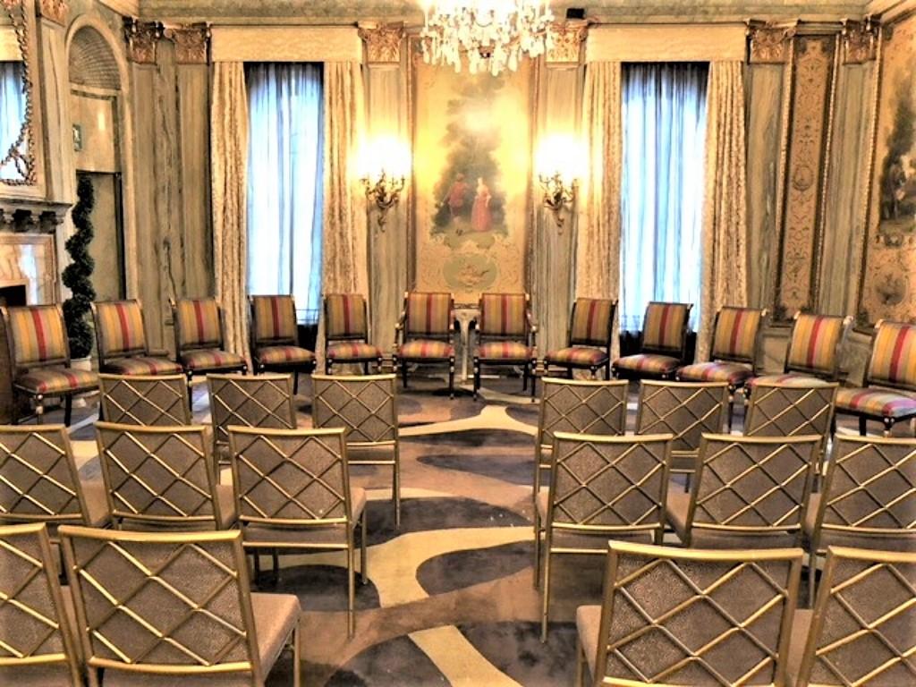 A set of 12 Louis XVI or Hollywood Regency style dining chairs in the Maison Jansen style. The second picture shows the chairs on the set of the TV show Madam Secretary. Straight out of a fine Roslyn Long Island home, to our 1st source consignment,