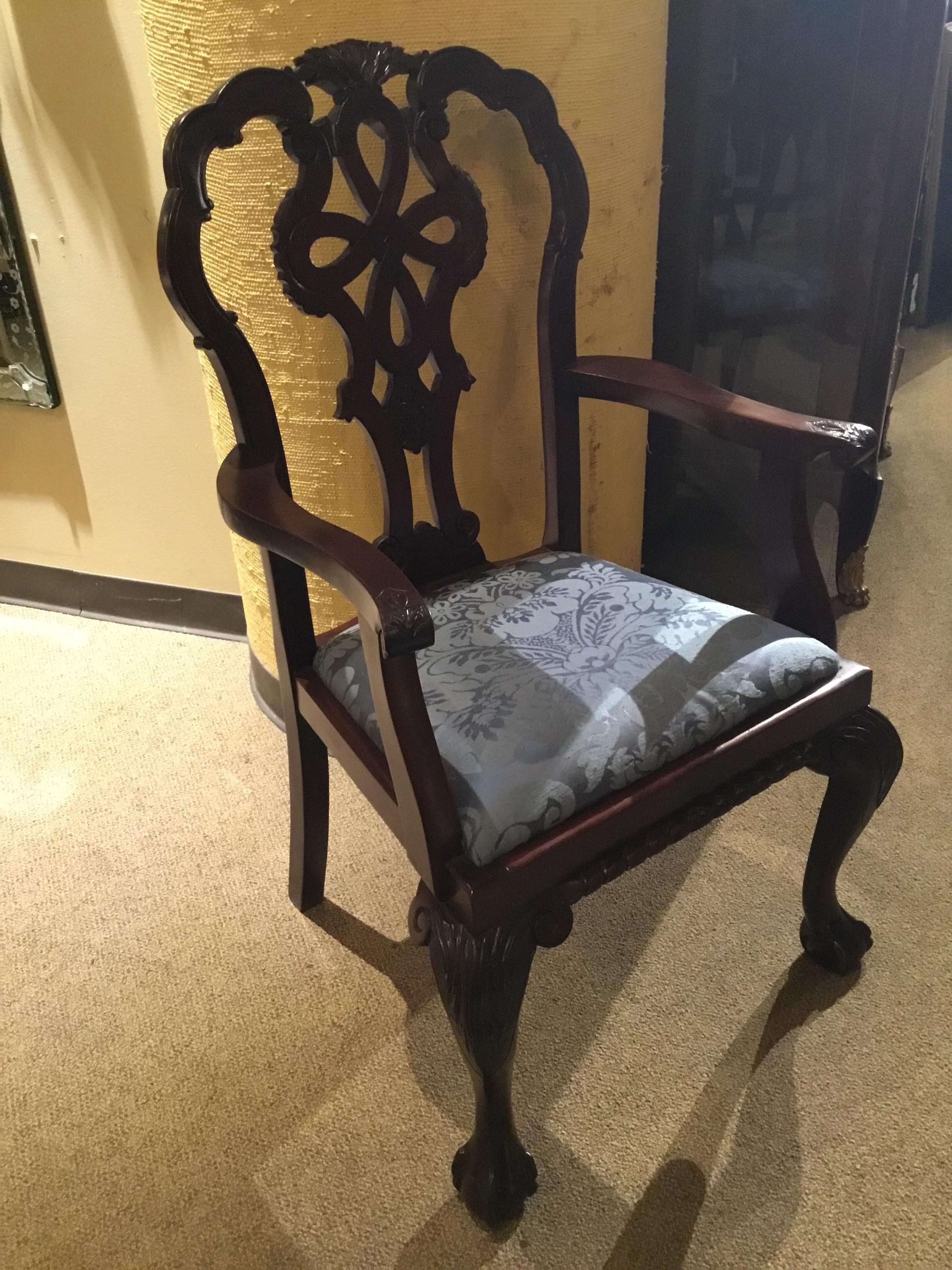 Complete set of George III style dining chairs in carved Mahogany
Having a ribbon back with ball and claw foot. The set has two arm
Chairs and ten side chairs. They are all tight and do not have any
Wiggles. They are both comfortable and sturdy.