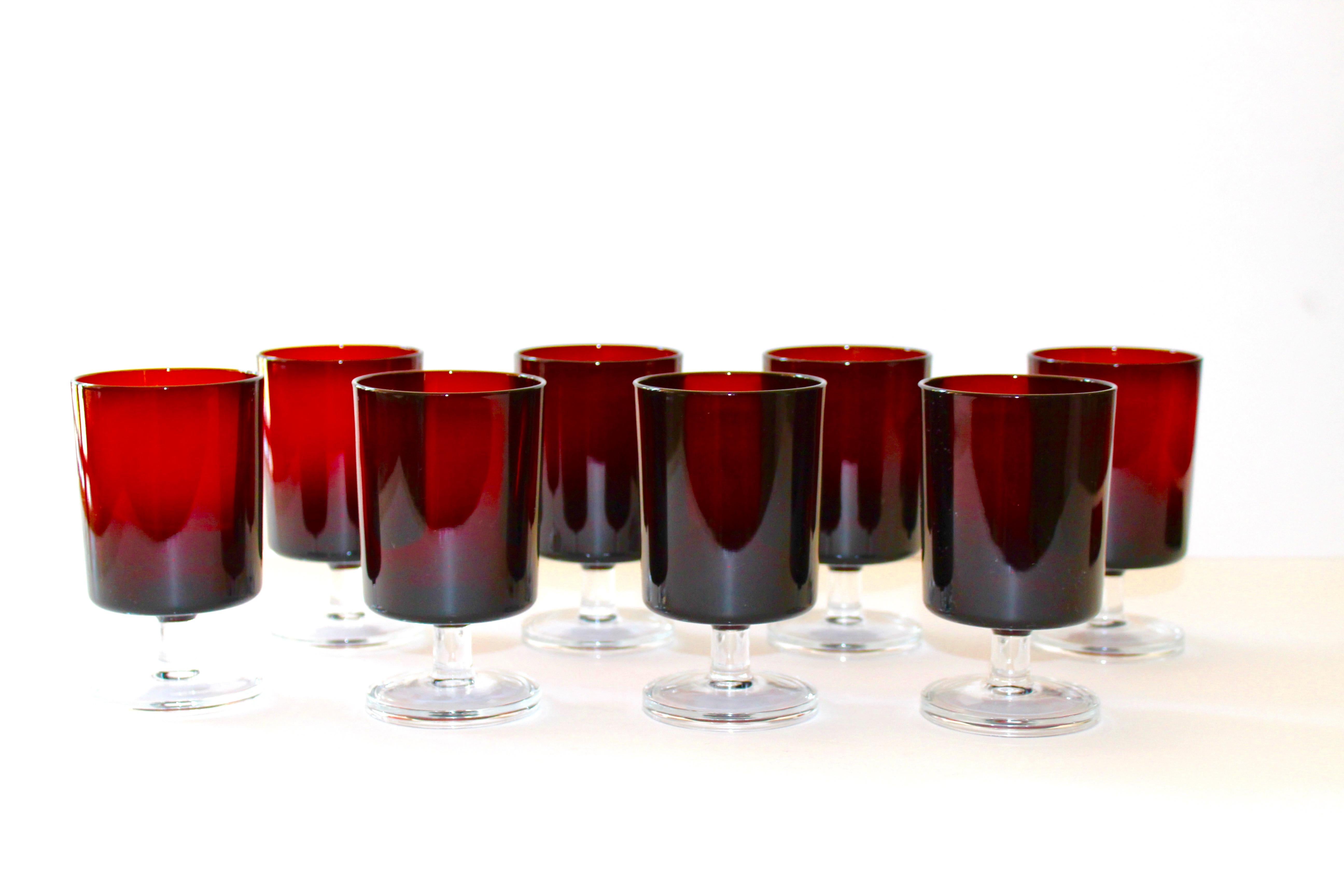 Set of 12 French vintage crystal wine goblets or liquor glasses in a gorgeous gemstone garnet red with clear glass stems. Glasses have Minimalist design with cylinder forms. Stamped 