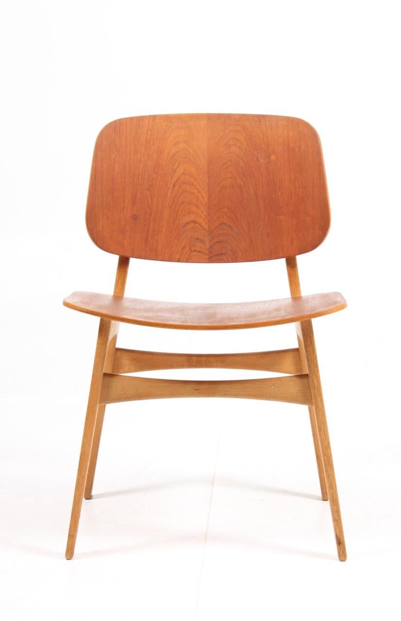 Set of 12 side chairs in teak on a solid oak frame. Designed by MAA. Børge Mogensen, made by Søborg Møbelfabrik Denmark in the 1950s. Good original condition.
