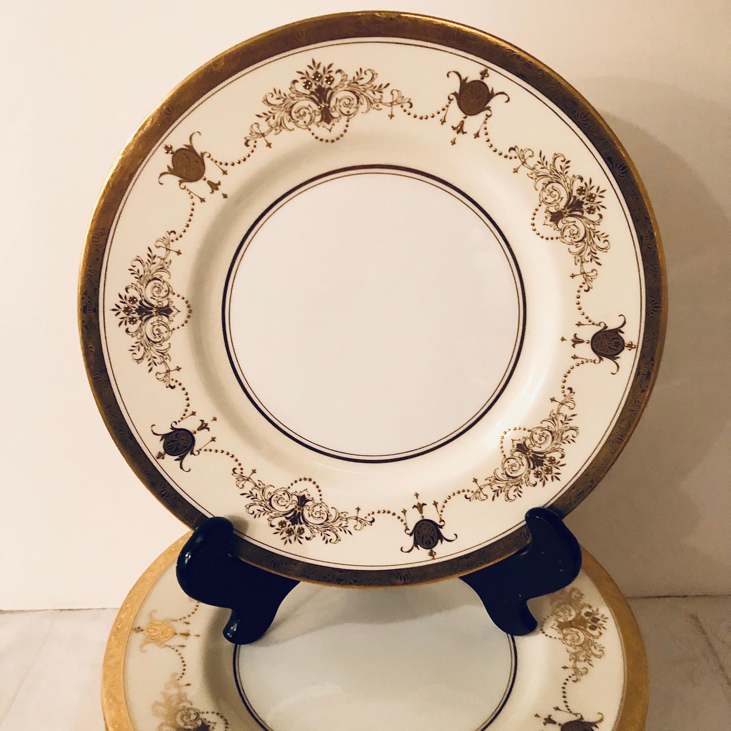 Rococo Set of 12 Minton Dinner Plates Decorated with Ribbons of Raised Gilded Jeweling For Sale