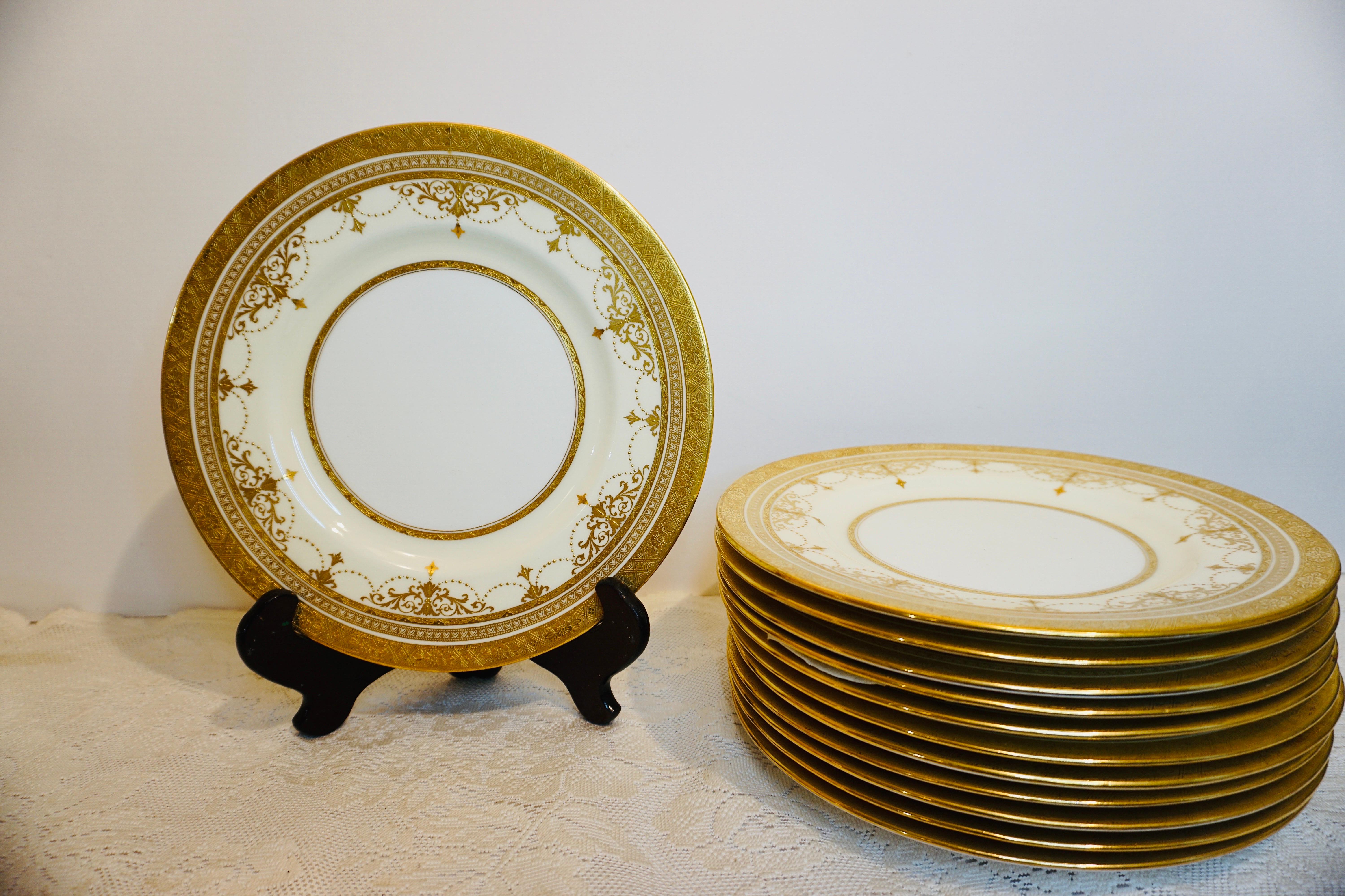 Porcelain Set of 11 Minton Dinner Plates with Raised Gold Jeweled Garlands and Gold Border