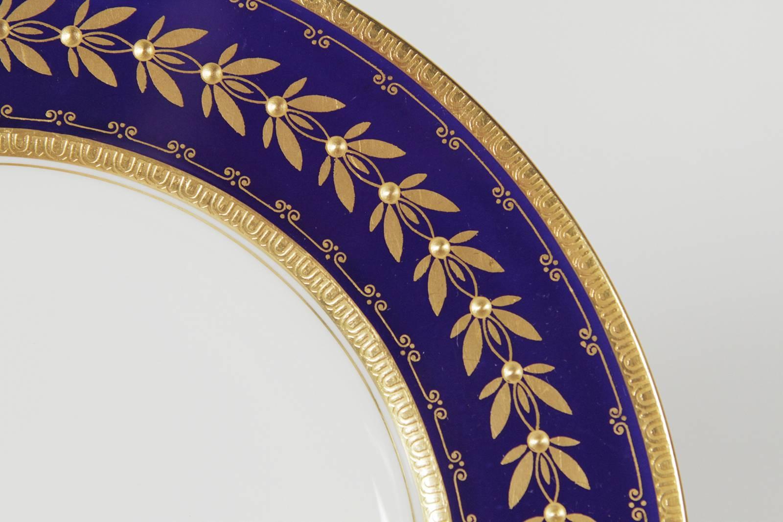 Set of 12 Minton Tiffany & Co. cobalt blue and gold gilt service plates. These plates have raised gilt borders over a rich cobalt blue background, made exclusively for Tiffany.