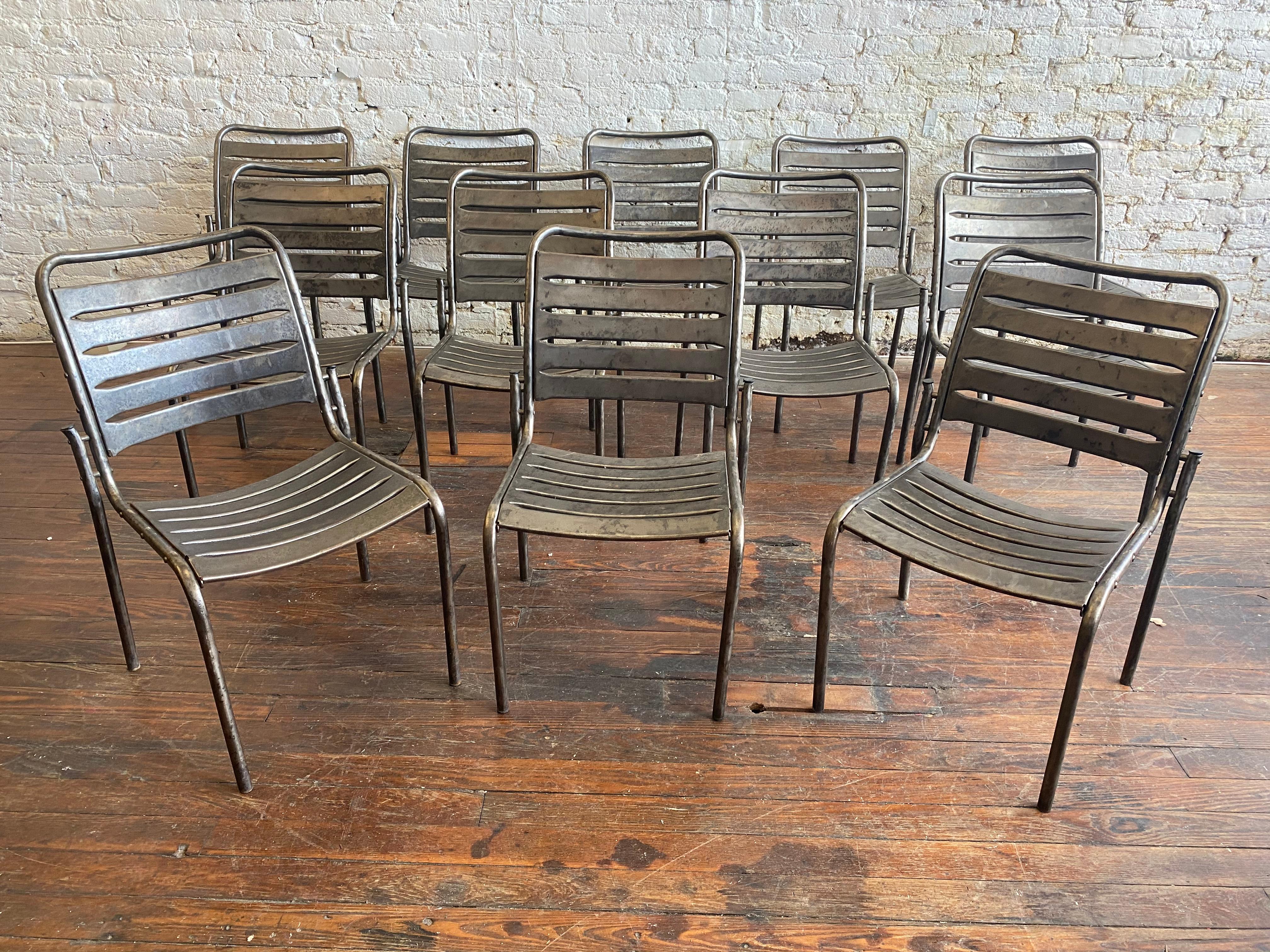 Great set of 12 modern metal chairs. Stripped and polished.