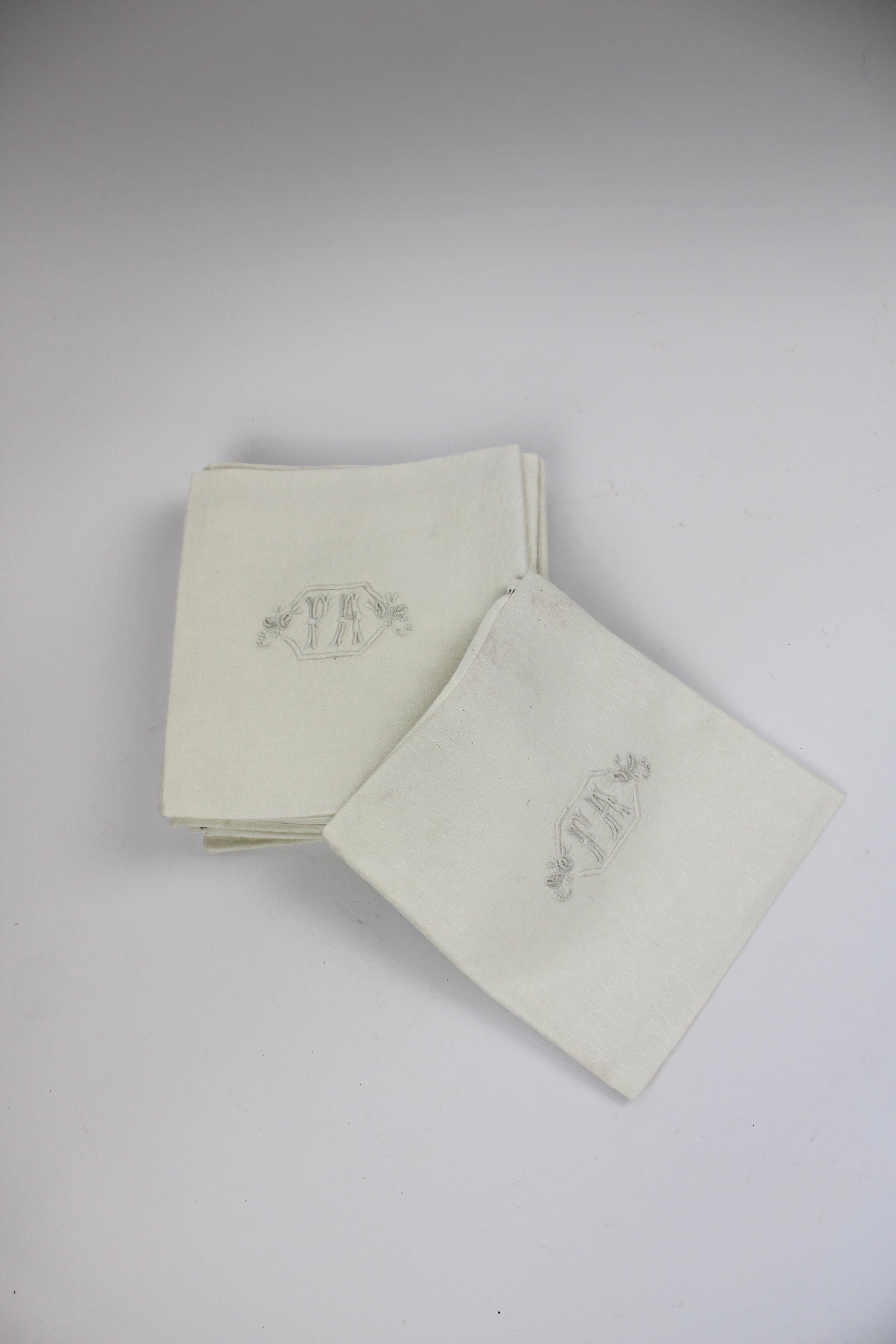 Introducing a set of 12 Antique Large Cream Colored Belgian Linen Table Napkins. Each napkin is crafted from high-quality Belgian linen, known for its durability and luxurious feel. These elegant napkins feature a beautifully woven design that adds