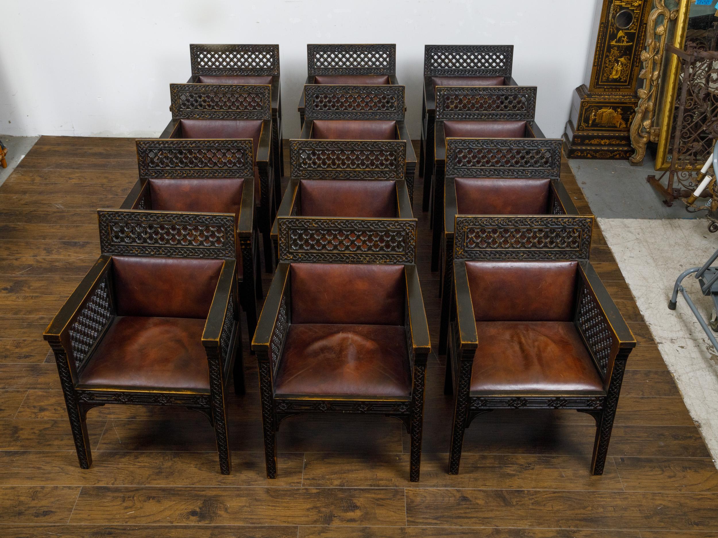 Set of 12 Moroccan Ebonized Carved Wood Armchairs with Leather Seats, circa 1900 In Good Condition For Sale In Atlanta, GA