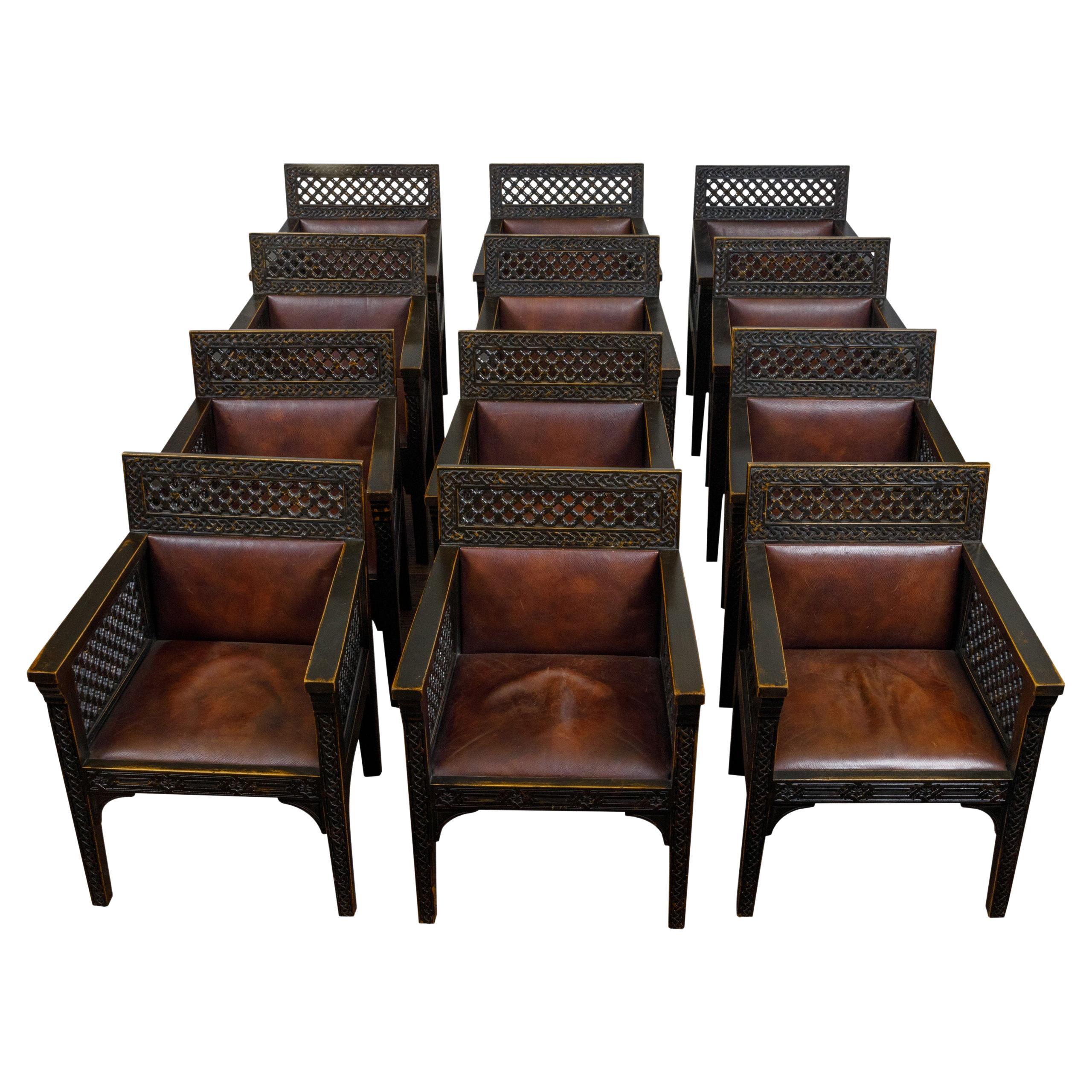 Set of 12 Moroccan Ebonized Carved Wood Armchairs with Leather Seats, circa 1900 For Sale