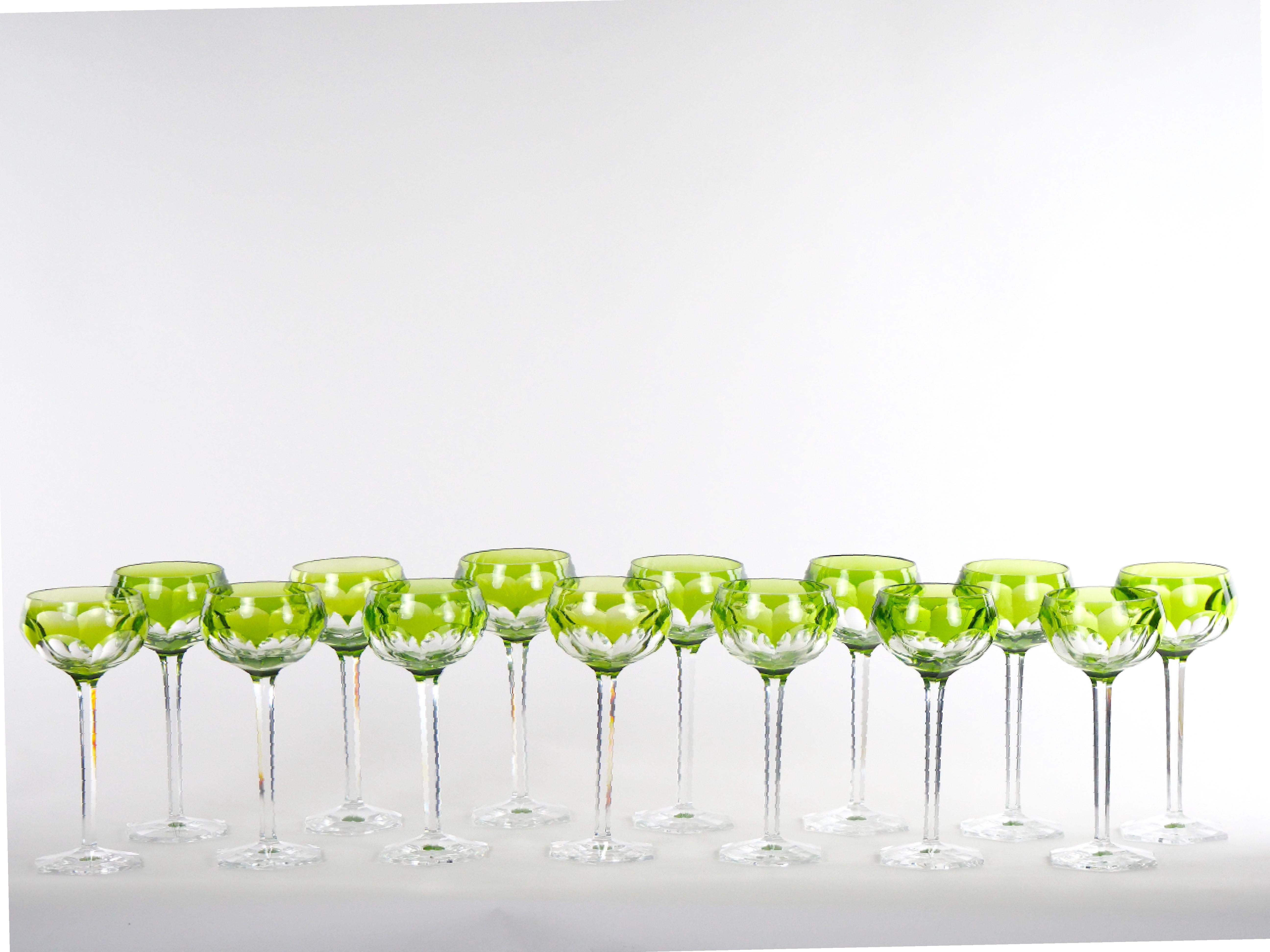 Exquisite Moser cut crystal paneled decorated design tableware / barware wine goblet service for 14 people. These are a dramatic and unusual pattern of handblown crystal goblets by Moser. The subtle apple green shaded top to clear, highlights the