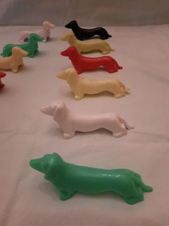 Set of 12 Multi Coloured Bakelite Dachshund Knife Rests, C1940