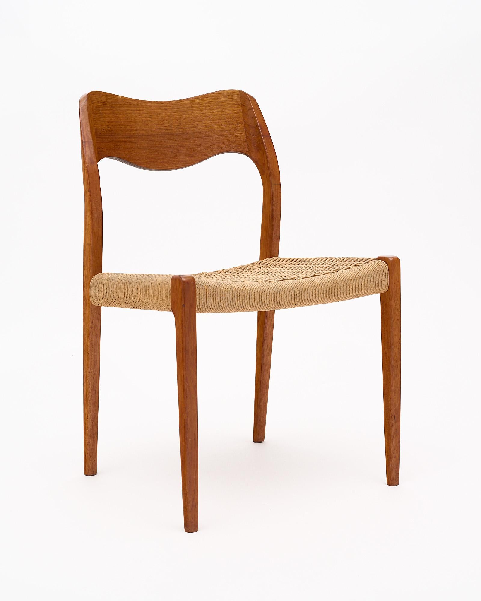 Set of twelve dining chairs by Niels Møller, Model No. 71. These chairs are made of solid teak with Danish cord seats. Designed in 1951 and produced by J. L. Möller Höjbjerg. The chairs feature a solid wood frame that is impeccably shaped. Møller