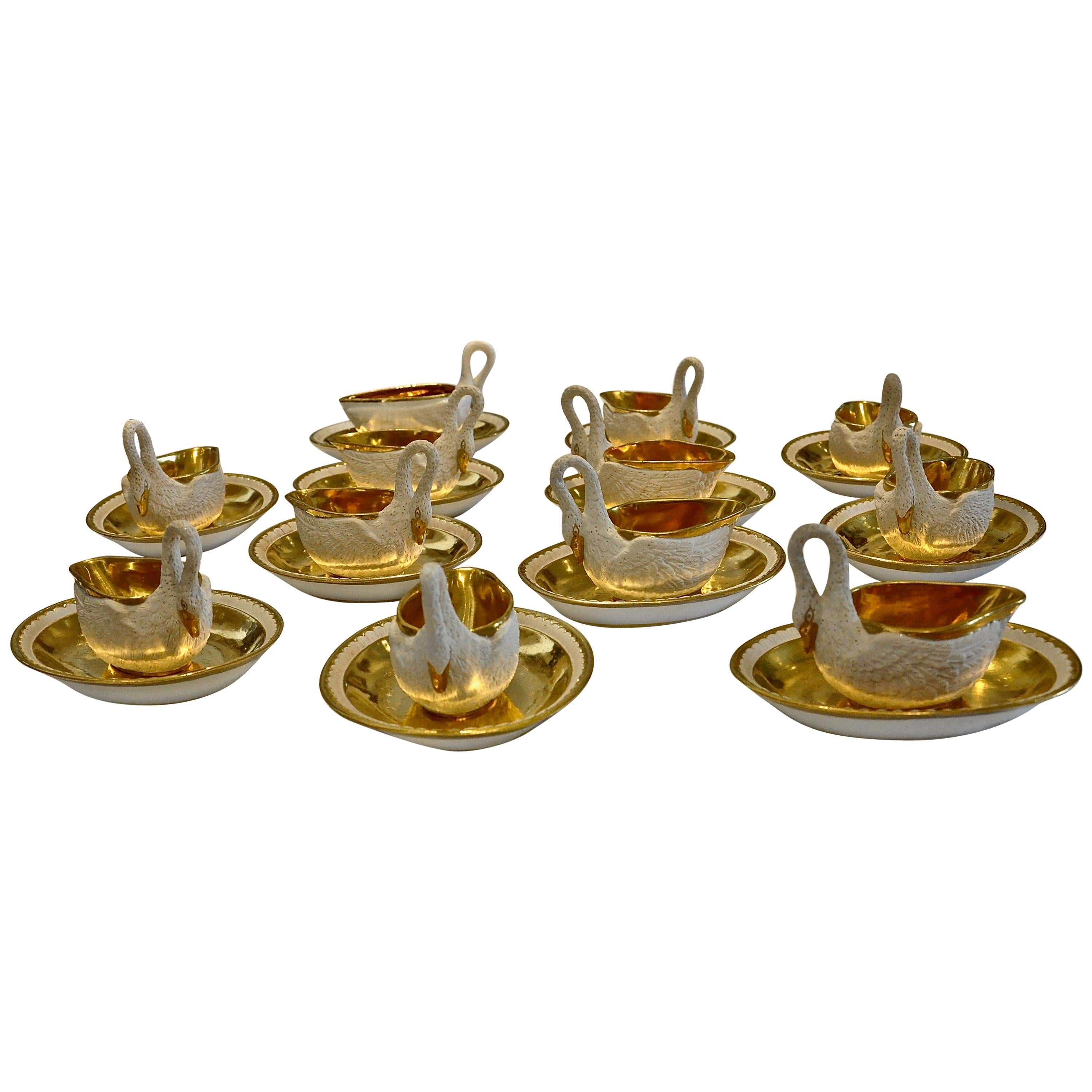 Set of 12 Period Empire Bisque Porcelain and Gilt Swan Cups, Marked Sevres