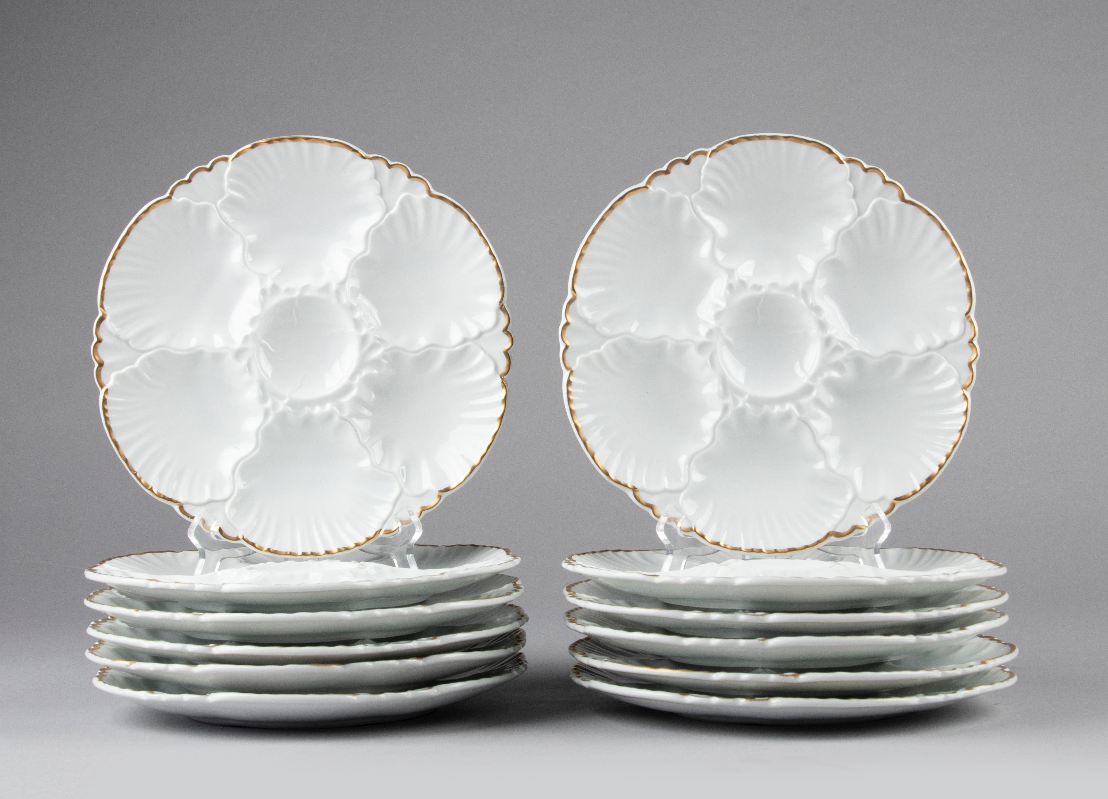 Nice set of 12 porcelain oyster plates from the Belgian brand Cerabel Porcelaine de Baudour.
The plates are white in color, beautifully shaped with a relief pattern and gold-coloured edges. Each plate has room for 6 oysters.
The plates are in very