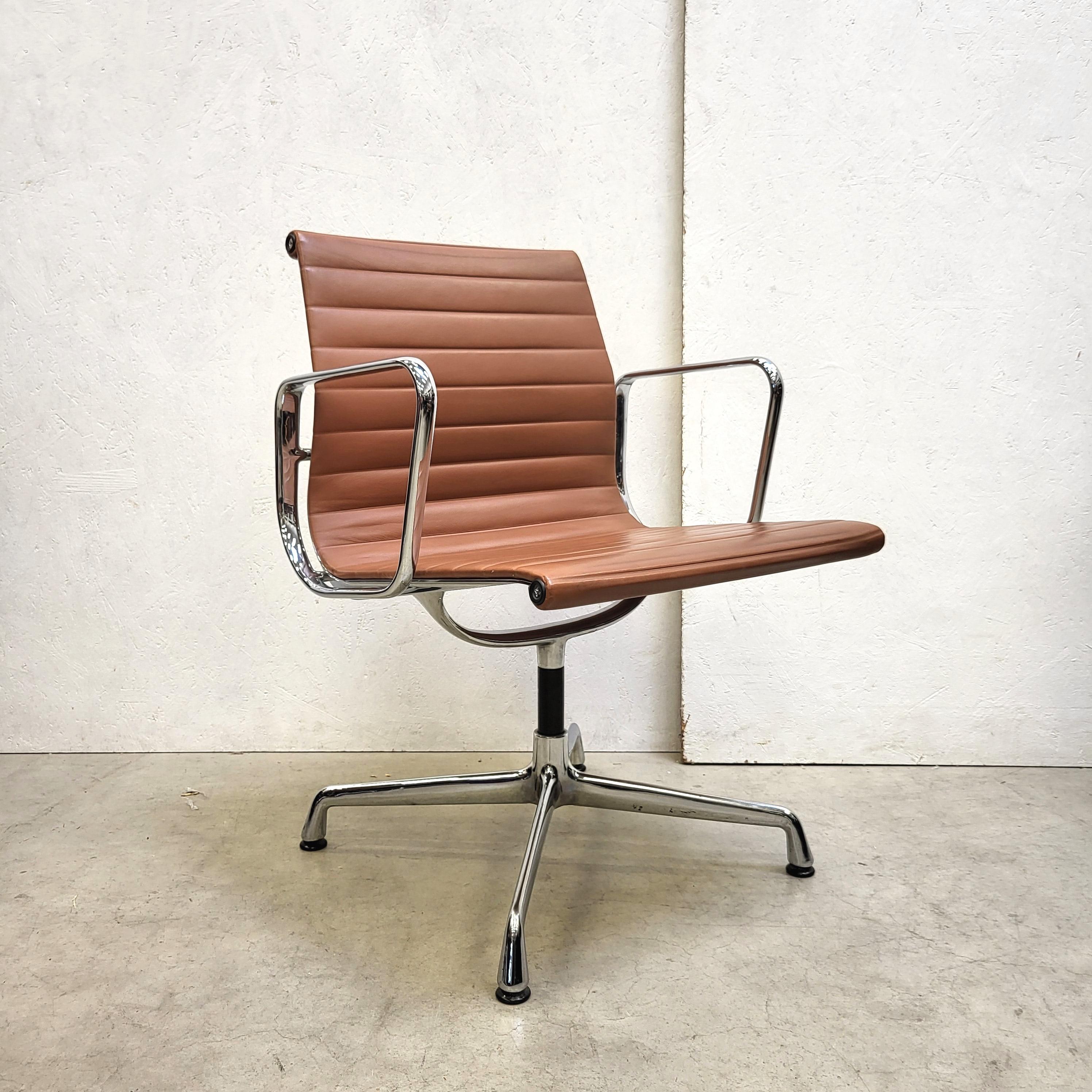 Rare set of 12 Cognac leather chairs model EA107 produced by Vitra. The chairs features a chromed aluminium frame and are all made between 1994 - 1998.

It is the premium edition which includes that the back is also covered with leather, Vitra