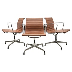 Set of 12 Rare Cognac Vitra EA107 Aluminium Chairs by Charles Eames