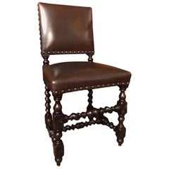 Set of 12 Renaissance Style Carved Oak and Leather Upholstered Dining Chairs