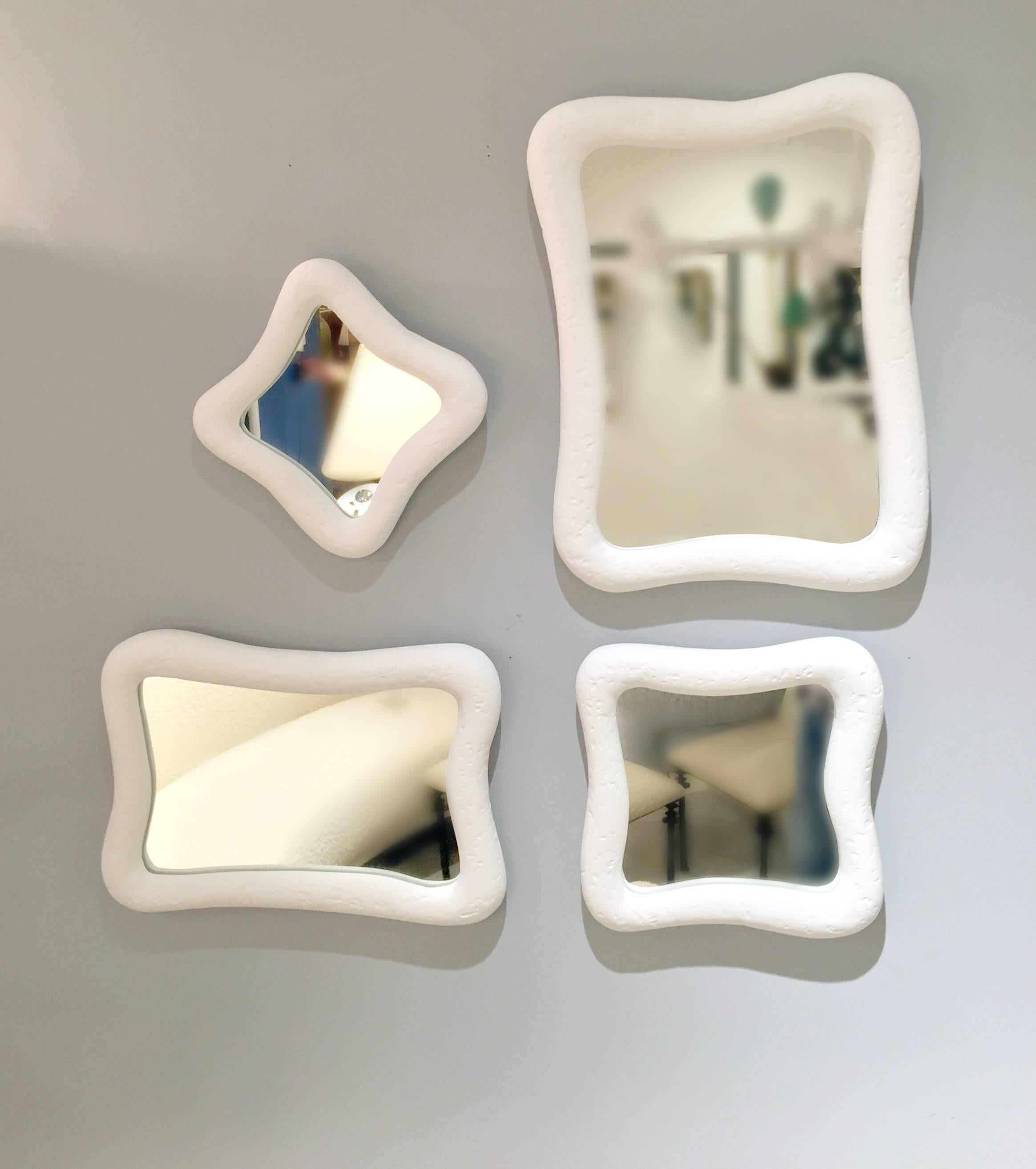 These 12 mirrors with their organic shapes are crafted with our signature plaster of
Paris finish. The disposition of mirrors can be arranged in various configurations. Mirror
dimensions three at 8